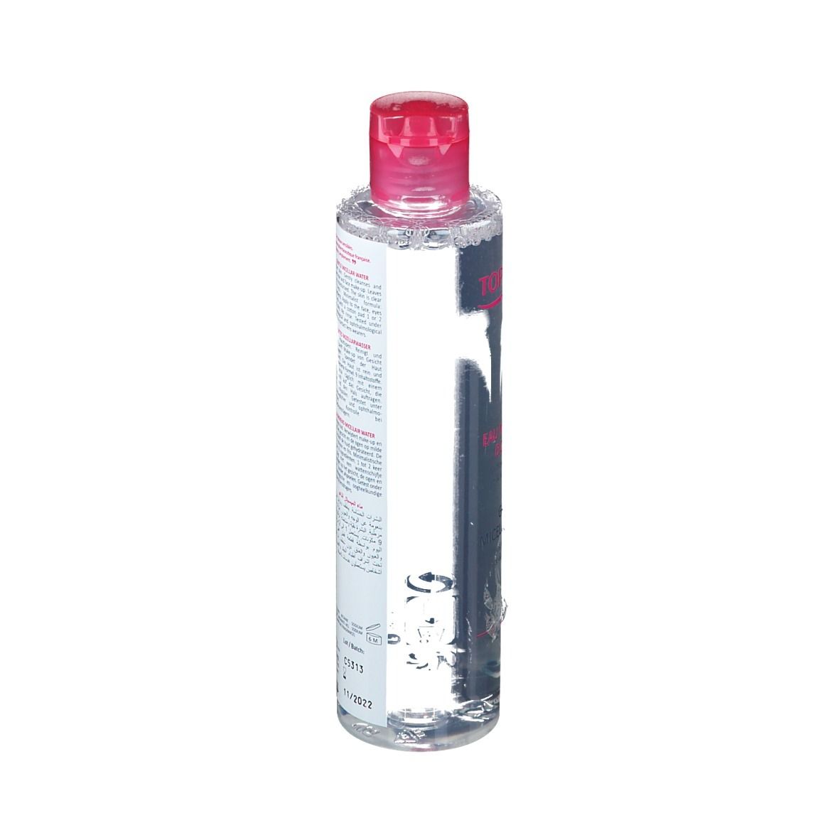 Rückansicht einer zylindrischen Flasche mit rosa Deckel. Etikett mit Produktinformationen und Verfallsdatum.