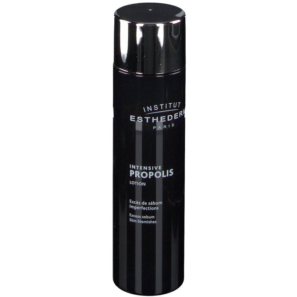 Schwarze Flasche mit silbernem Deckel. INSTITUT ESTHEDERM PARIS. Aufschrift: Intensiv Propolis Lotion. Gegen Hautunreinheiten.