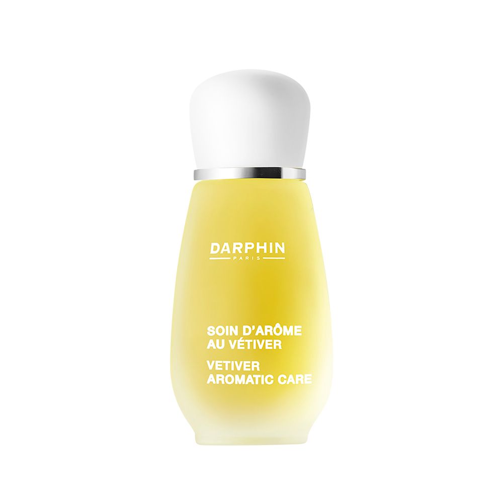 Gelbliche Flasche mit weißem Deckel. Beschriftung: DARPHIN, Soin d'Arôme au Vétiver, Vetiver Aromatic Care.