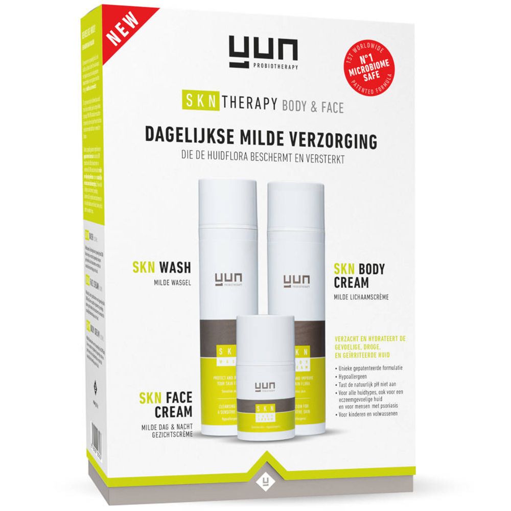 Verpackung mit drei YUN SKN Therapy Produkten: Waschgel, Körpercreme und Gesichtscreme. Weiß, grün und braun.