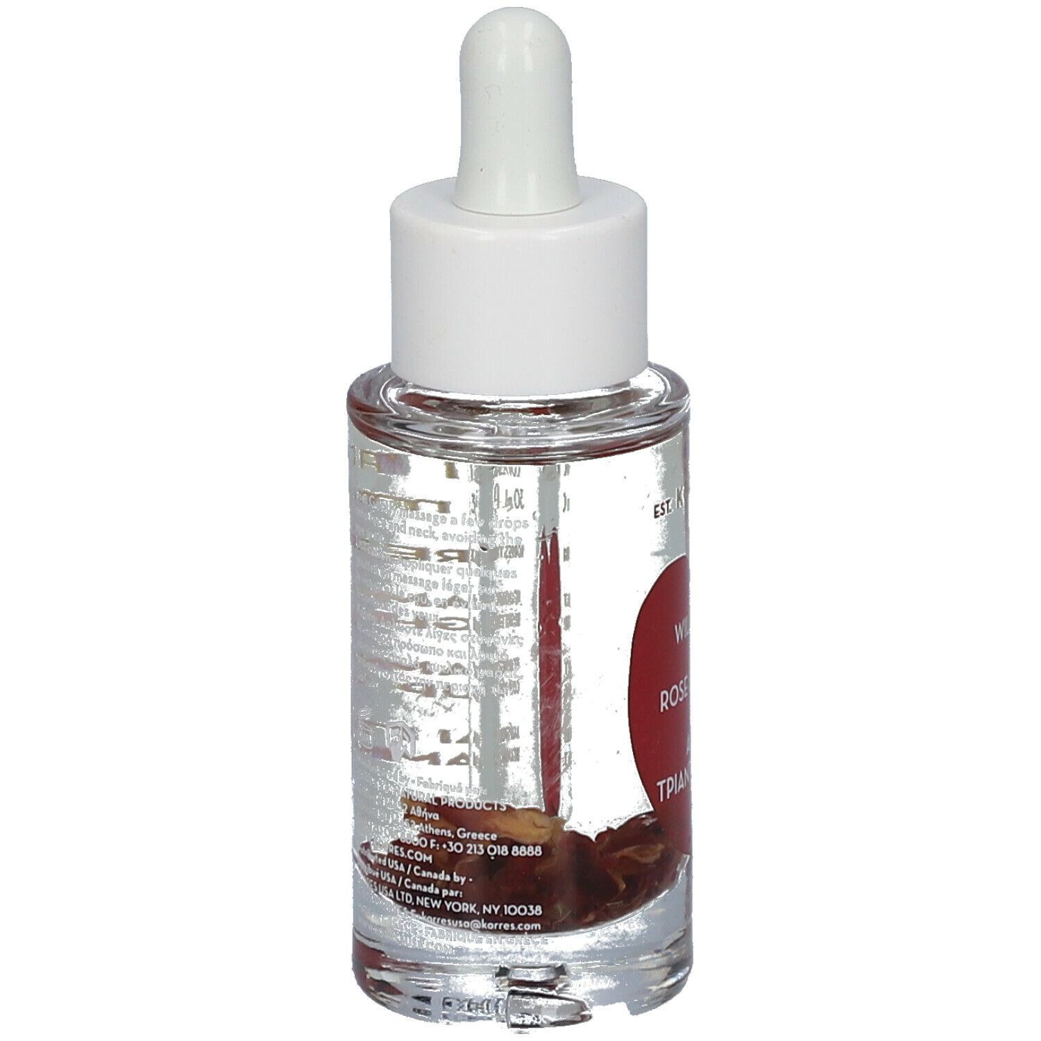 Klares Glasfläschchen mit weißem Deckel und Pipette. Rückseite mit Text. Wild Rose, Rose Sauvage, Αγριο Τριαντάφυλλο.