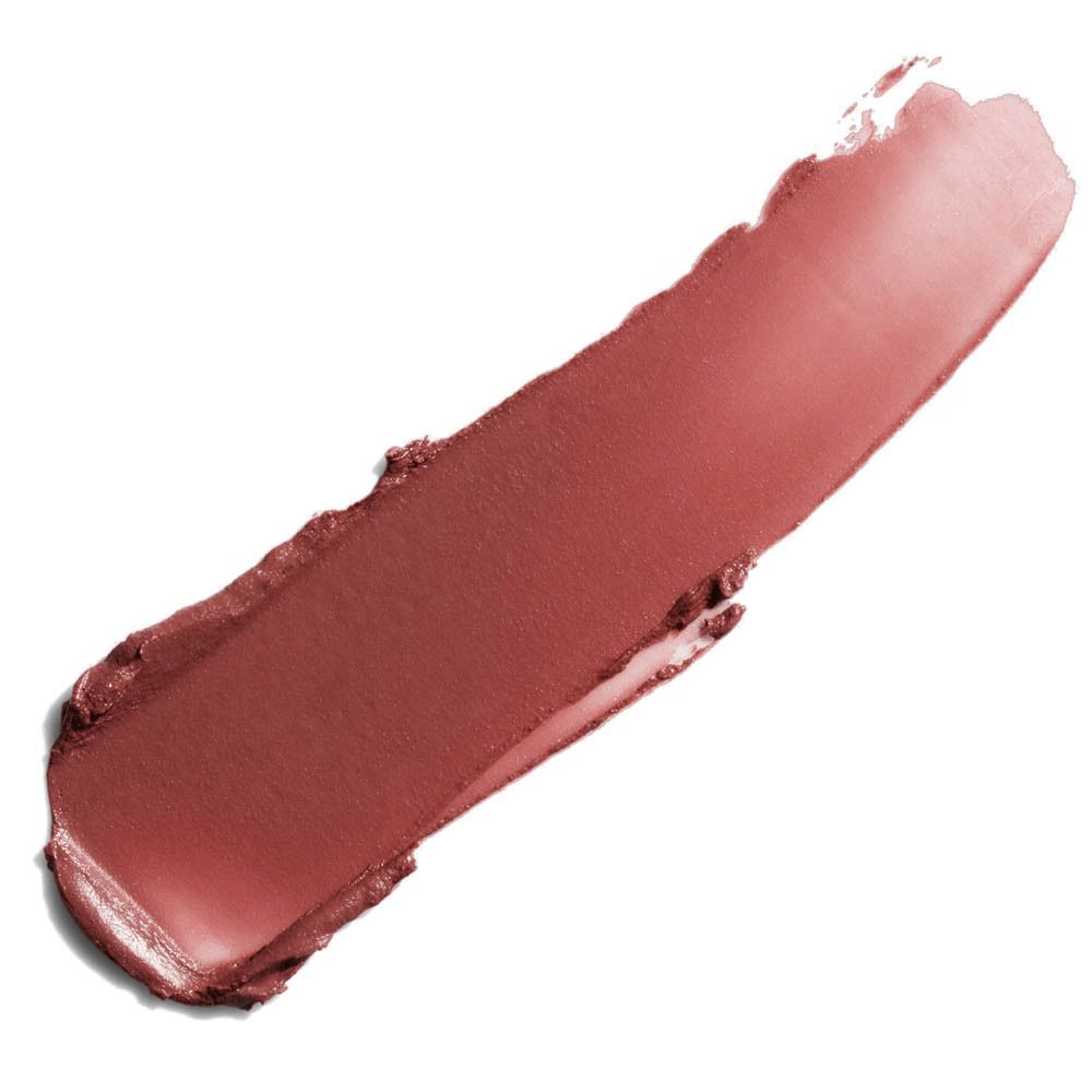 Ein ziegelroter Lippenstift-Fleck mit metallischem Schimmer.