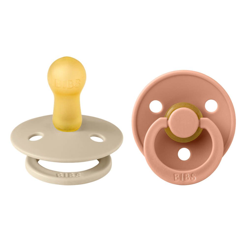 Zwei BIBS® Schnuller. Farben: Beige und Pfirsich. Runde Form. Größe 2. Silikon-Sauger.