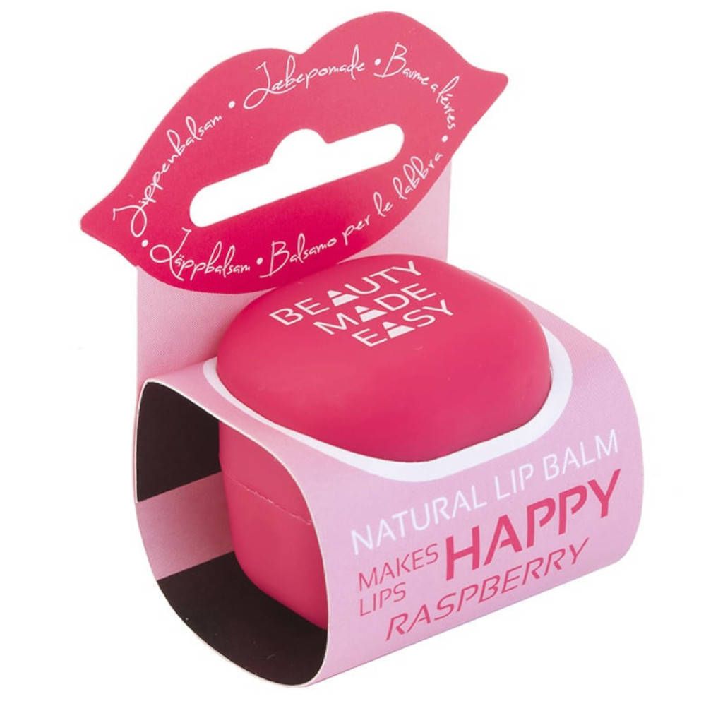 Runder, pinkfarbener Lippenbalsam in Verpackung mit Lippen-Motiv. Aufschrift: BEAUTY MADE EASY, HAPPY, RASPBERRY.