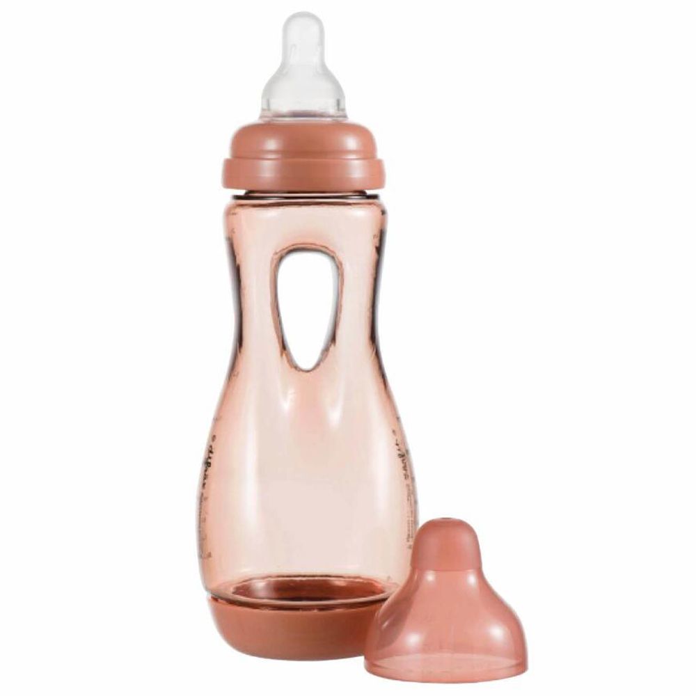 Babyflasche, rosa, mit Griff und Sauger. Deckel daneben.