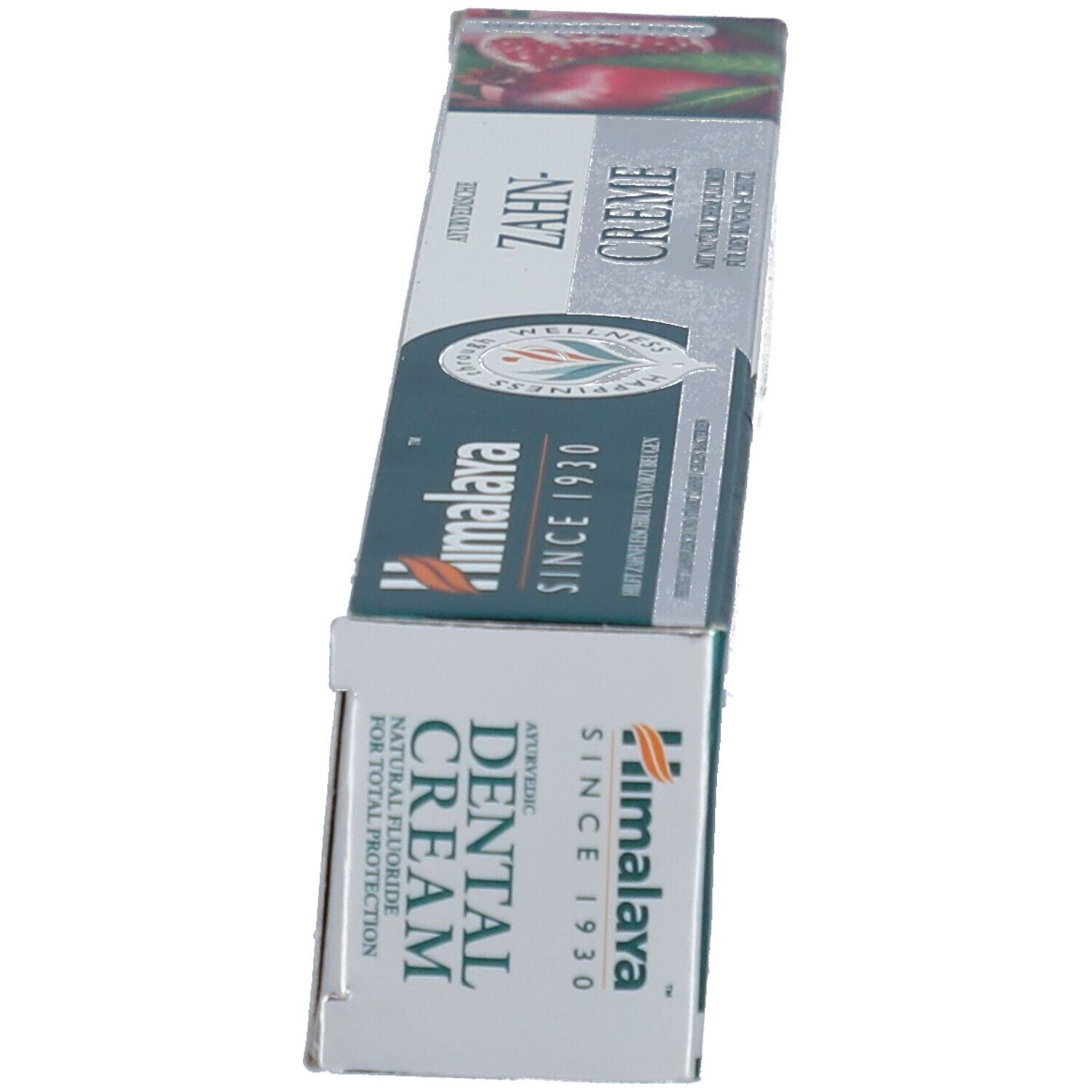 Zahncreme-Verpackung, schräg. Aufschrift: Ayurvedic Dental Cream. Marke: Himalaya. Seit 1930.