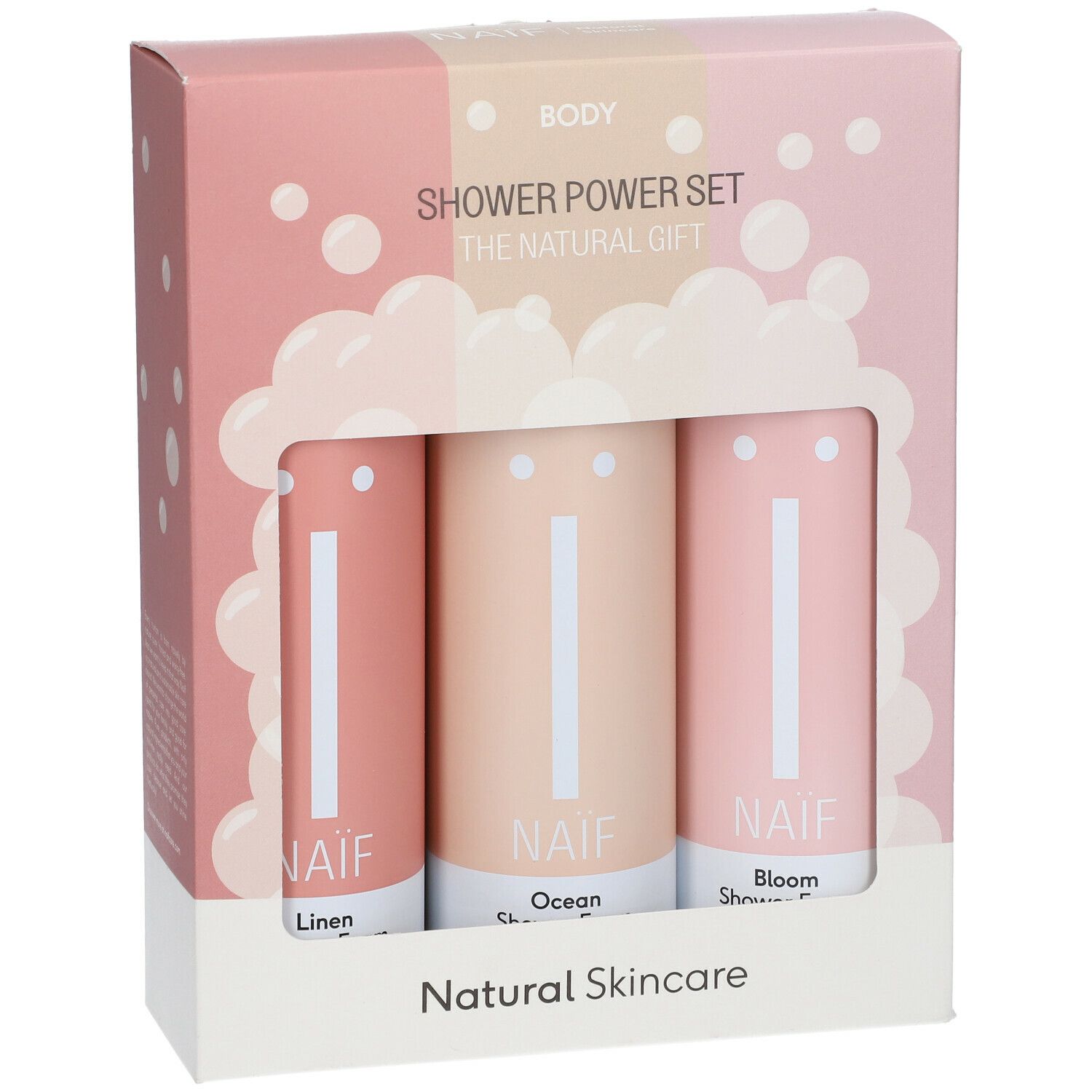 Geschenkset mit drei zylindrischen Produkten in einer rosa Schachtel. Die Produkte sind durch ein Fenster sichtbar. NAÏF-Logo.