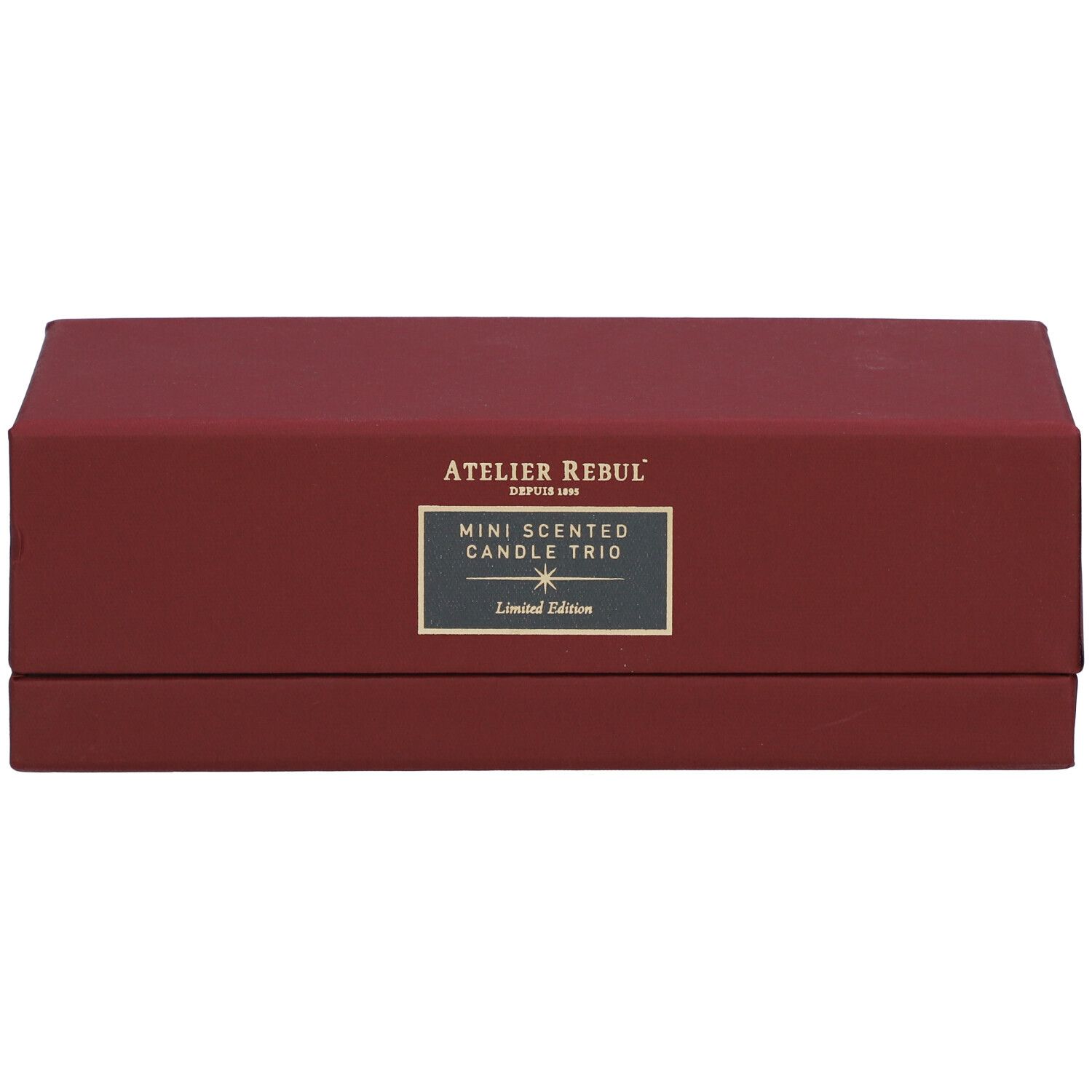 Rote rechteckige Schachtel mit Aufschrift 'ATELIER REBUL' und 'MINI SCENTED CANDLE TRIO'. 'Limited Edition' darunter.