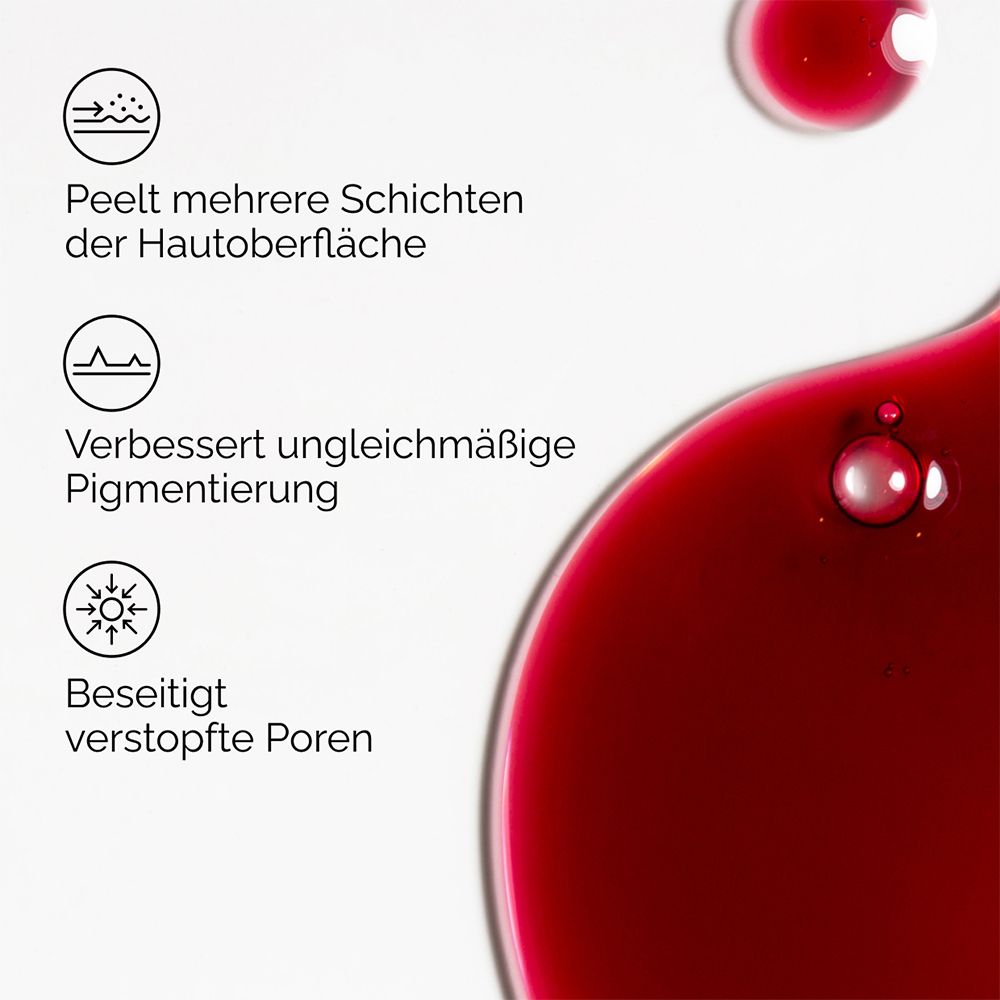 Nahaufnahme von roter Flüssigkeit. Text: Peelt mehrere Schichten, verbessert Pigmentierung, beseitigt Poren.