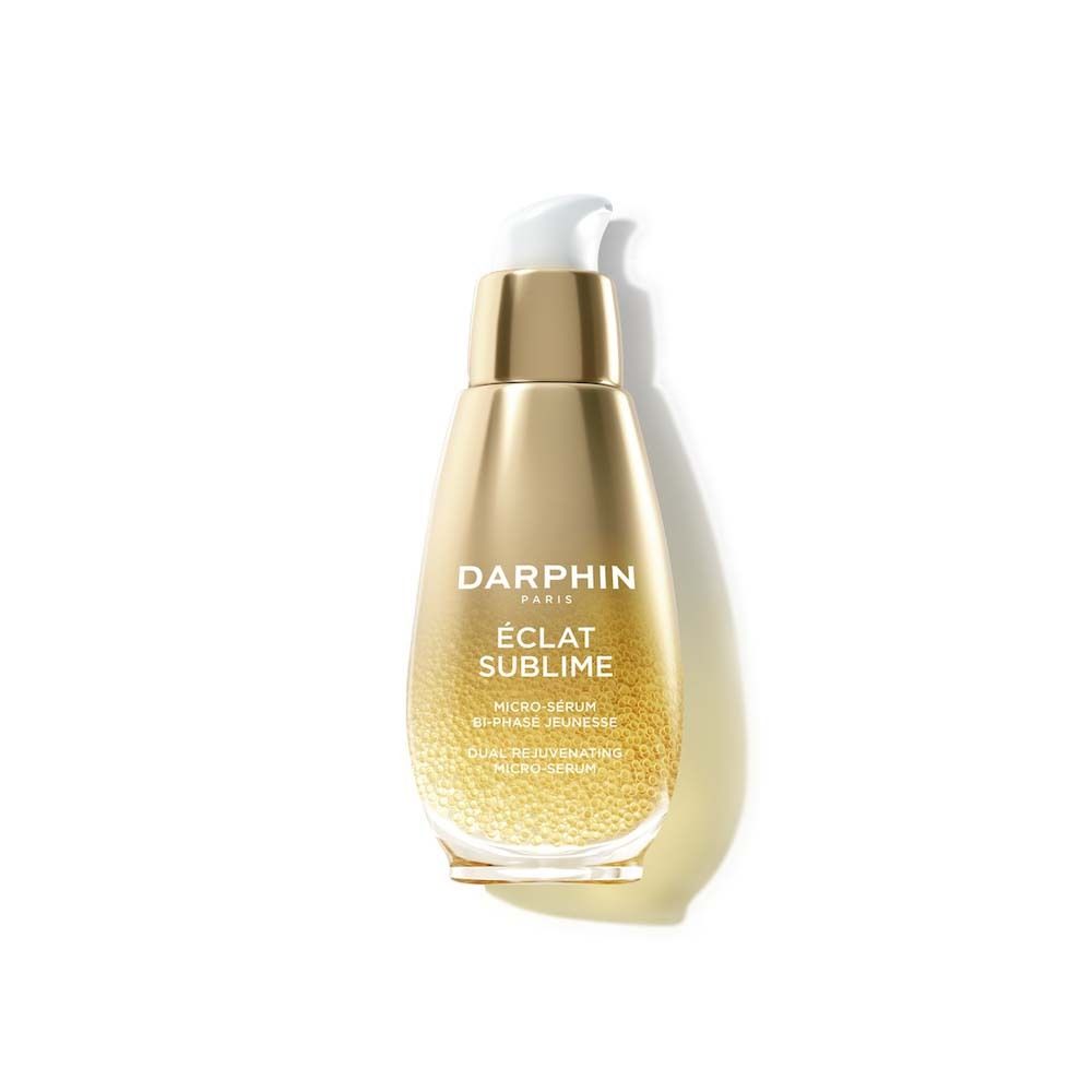 Goldene Flasche mit Serum. Darphin Paris, Éclat Sublime, Micro-Serum, Dual Rejuvenating Micro-Serum.