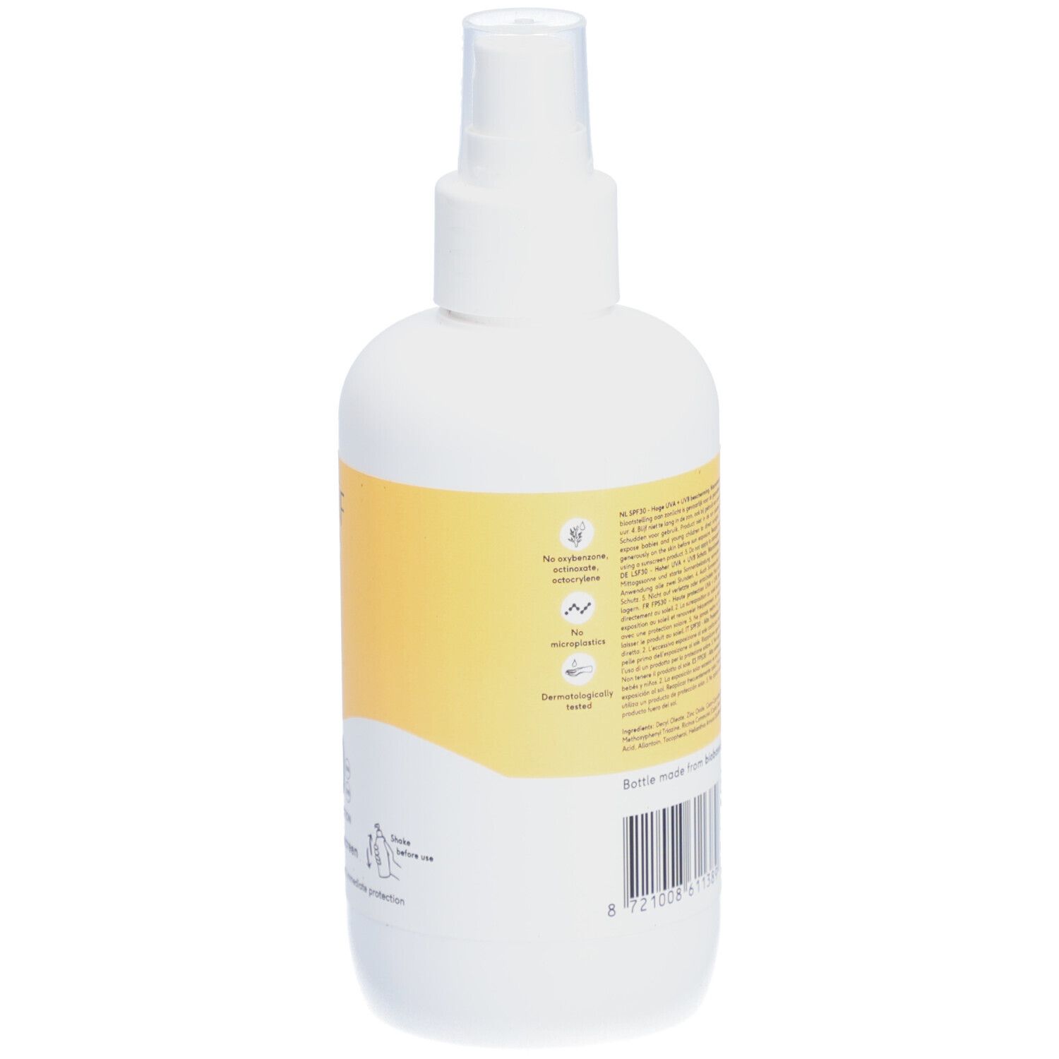 Rückseite einer weißen Flasche mit gelbem Etikett. Text auf dem Etikett. Barcode und Logos.