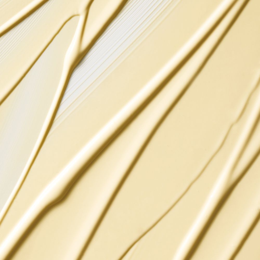 Nahaufnahme von cremefarbenen Streifen. Textur von Clinique Dramatically Different Moisturizing Lotion.