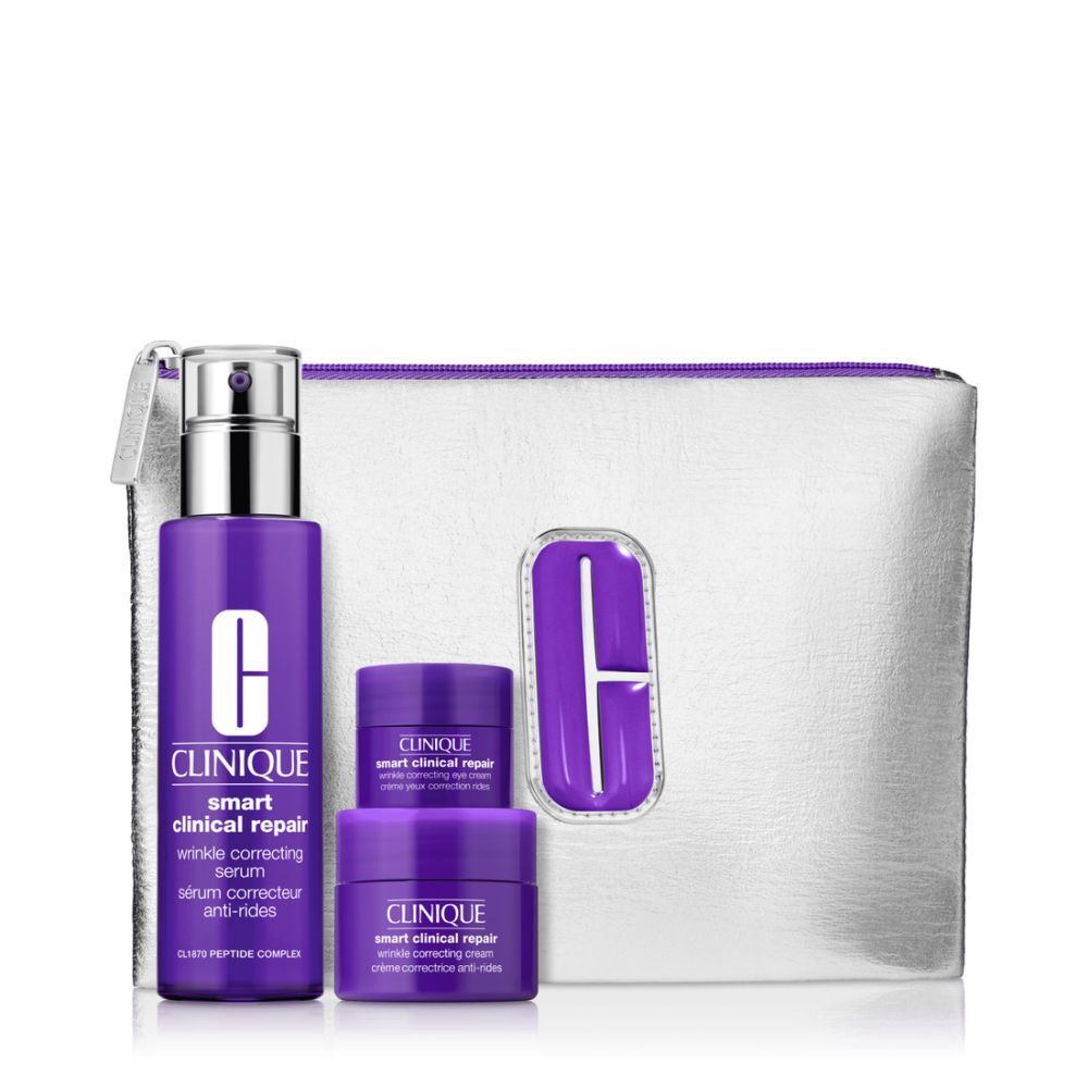 Kosmetikset mit lila Flasche, Tiegeln und silberner Kosmetiktasche. Text: Clinique, Smart Clinical Repair.
