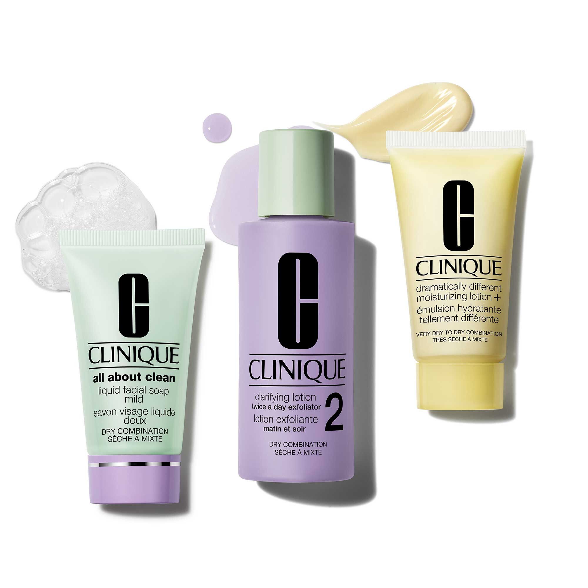 Drei Produkte: Reinigung, Peeling und Feuchtigkeitspflege. Marke Clinique. Für trockene bis Mischhaut. Produkte auf weißem Hintergrund.