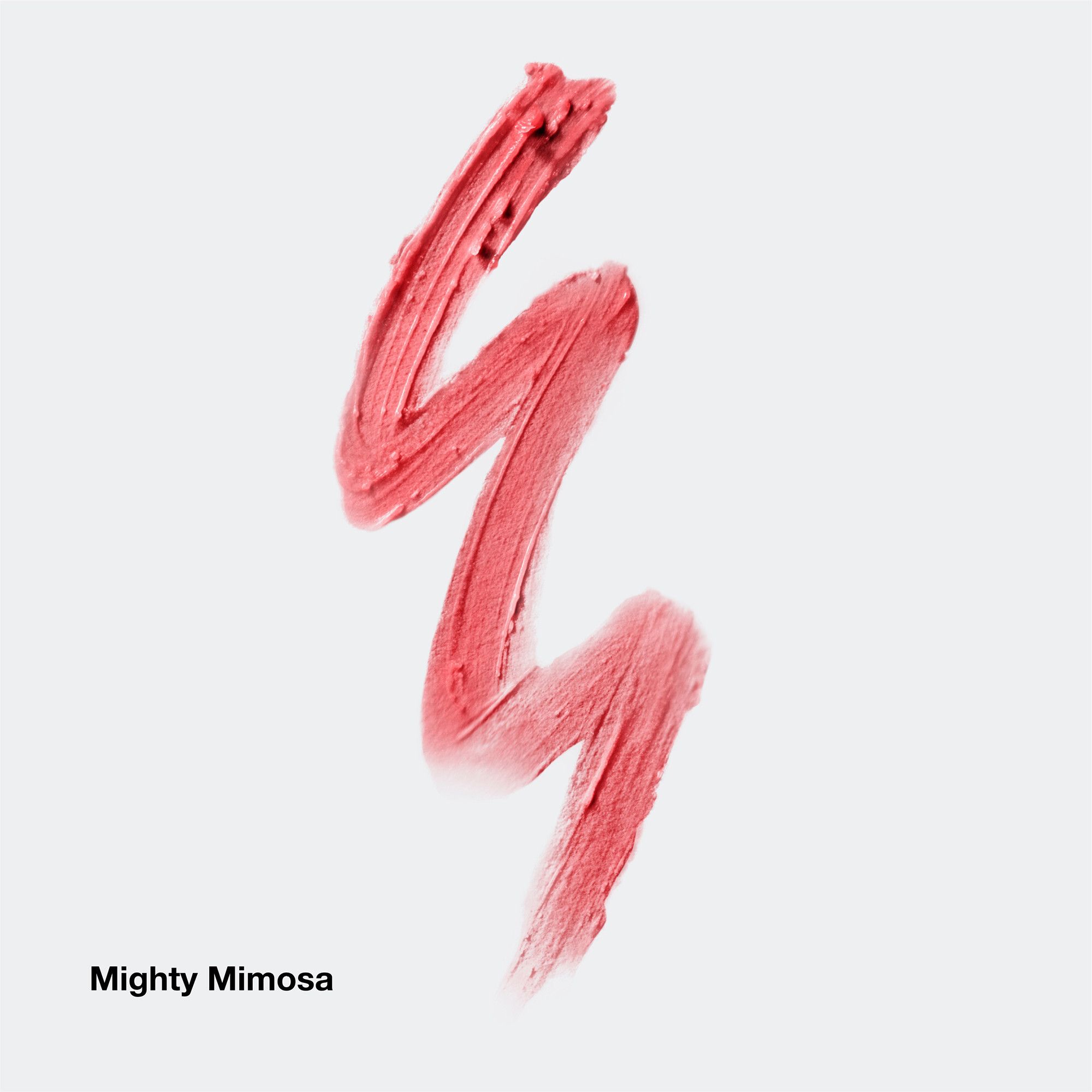 Mighty Mimosa Lippenstift-Abstrich. Rosa Farbton. Text: Mighty Mimosa.
