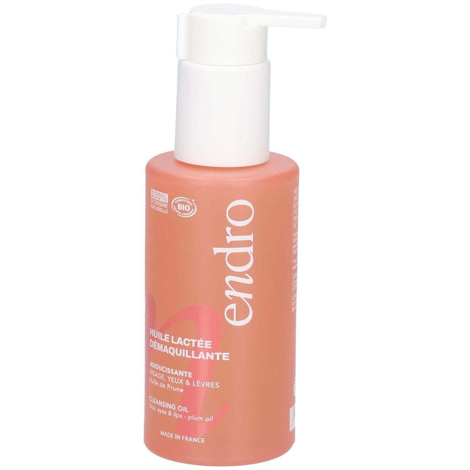 Endro Cleansing Oil Flasche mit Pumpspender. Korallenfarbene Flasche mit weißem Etikett und Aufdruck.