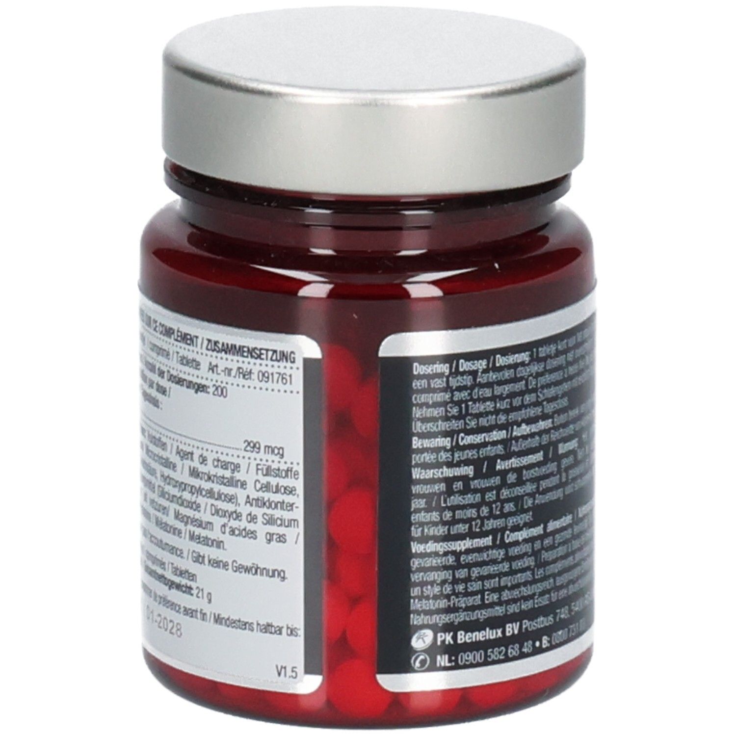 Rückseite einer braunen Glasflasche mit silbernem Deckel. Rote Tabletten sichtbar. Textinformationen auf Etikett.