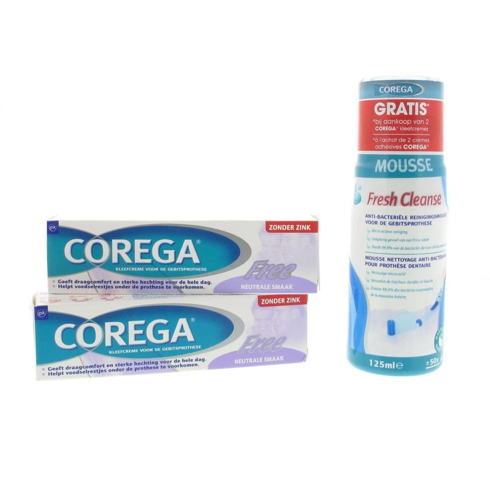 Zwei Corega-Creme-Tuben und eine Flasche Corega Mousse. Auf den Tuben steht "Free". Auf der Flasche steht "Gratis".