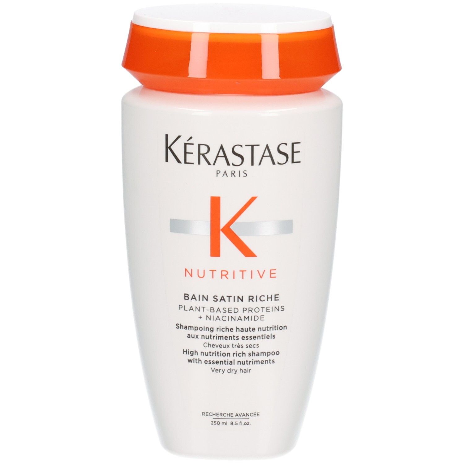 Kérastase Nutritive Bain Satin Riche Shampoo, weiße Flasche mit orangefarbenem Deckel. Enthält pflanzliche Proteine und Niacinamid.