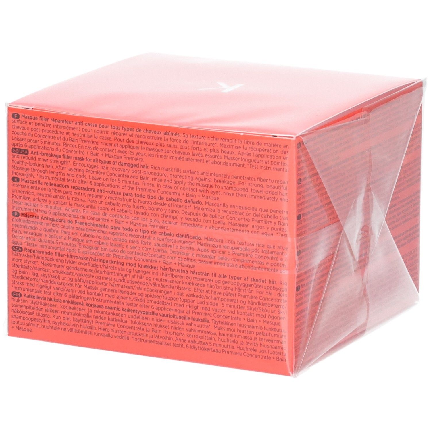 Rote Verpackung für eine Haarmaske mit Text in mehreren Sprachen.