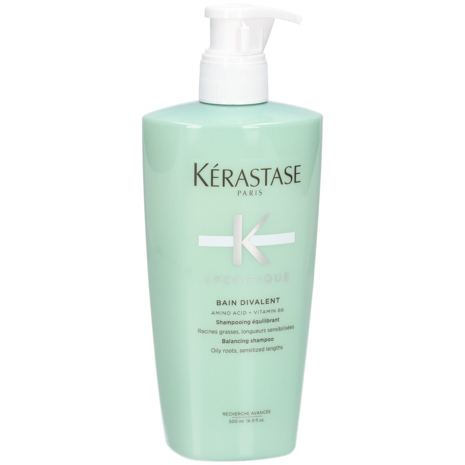 Kérastase Spécifique Bain Divalent Balancing Shampoo in mint green bottle with pump dispenser.