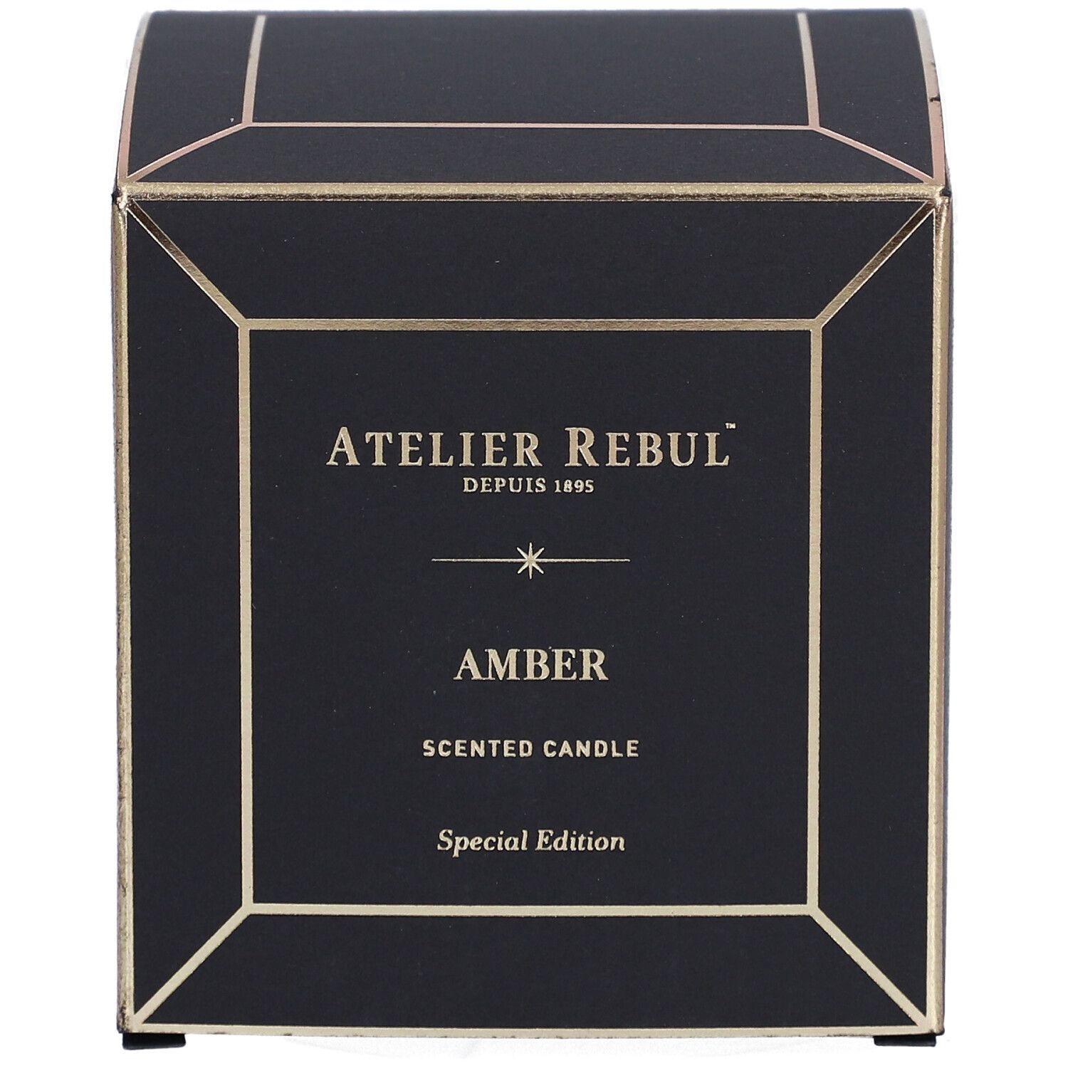 Schwarze quadratische Schachtel mit goldfarbenen Akzenten. Aufschrift: "ATELIER REBUL", "AMBER" und "SCENTED CANDLE".