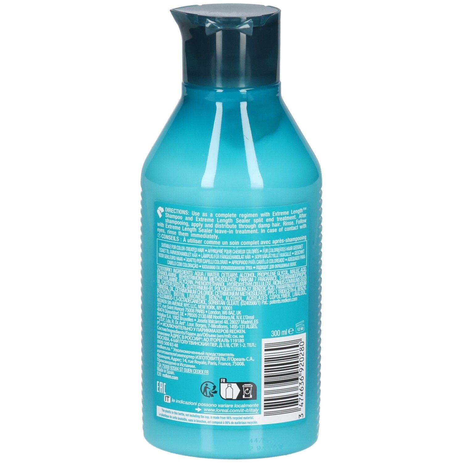Rückseite einer türkisfarbenen Flasche mit dunkelblauem Deckel. Textinformationen und Barcode. Enthält REDKEN Extreme Length Conditioner.