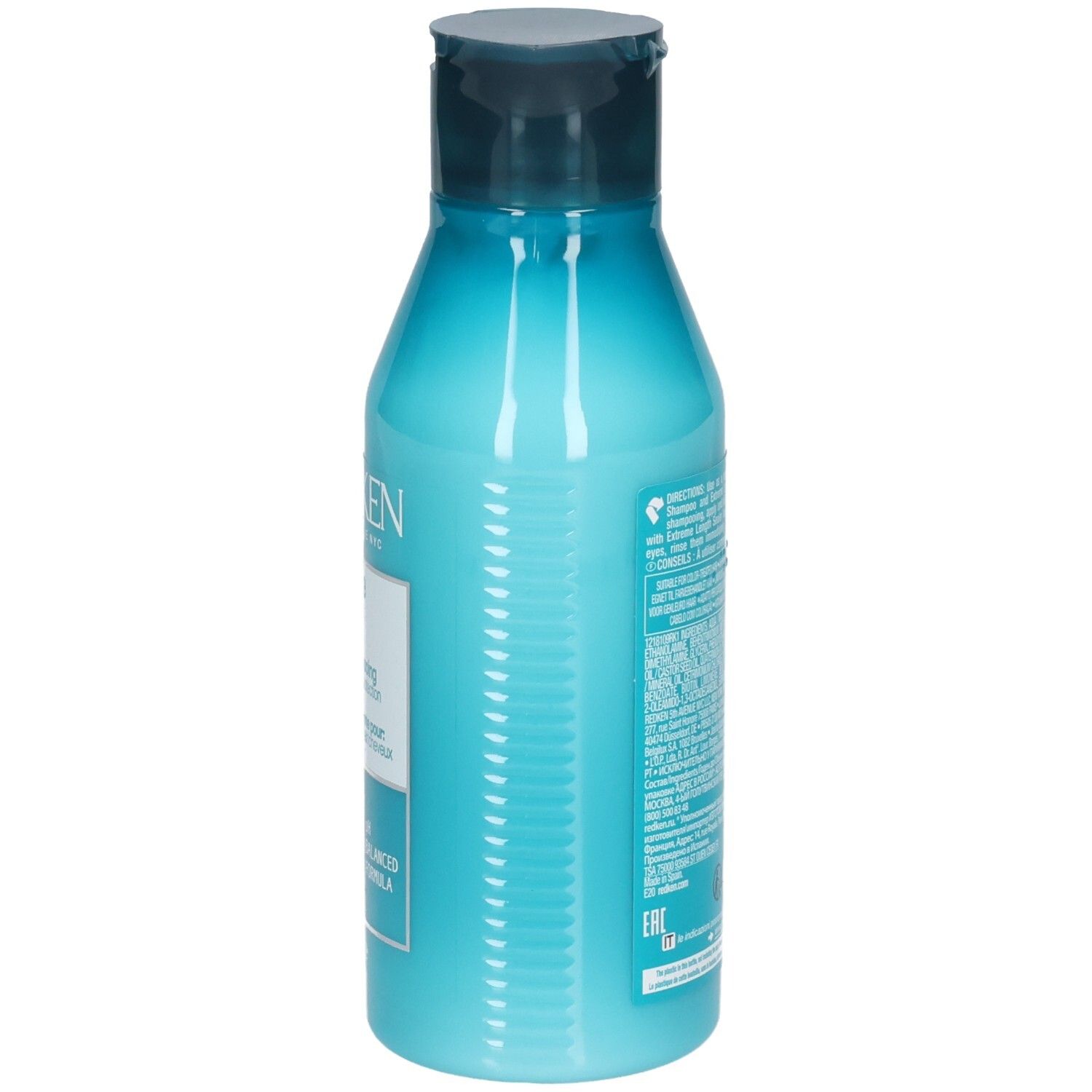 Seite einer türkisfarbenen Flasche mit dunkelblauem Deckel. Textinformationen. Enthält REDKEN Extreme Length Conditioner.