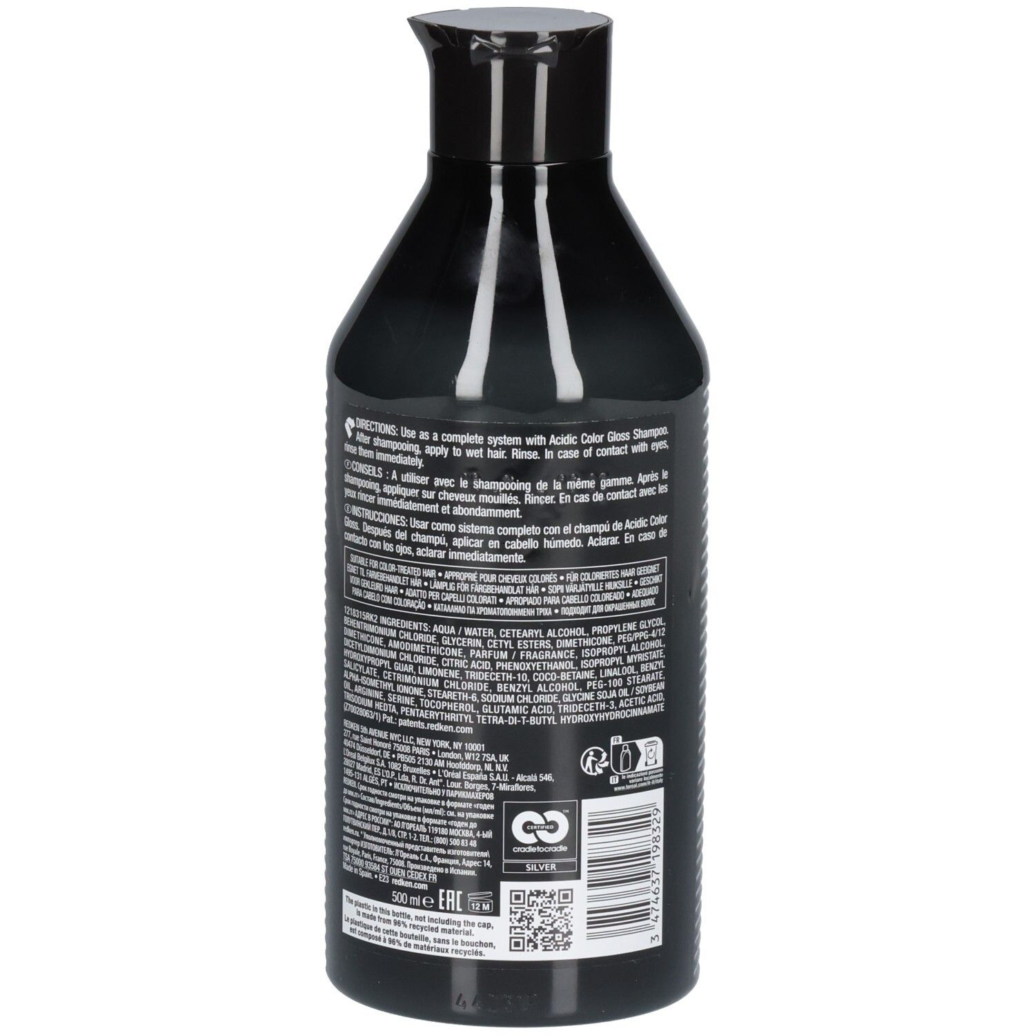 Rückseite einer schwarzen Flasche. Text mit Inhaltsstoffen und Anweisungen. REDKEN-Logo und Recycling-Symbol.