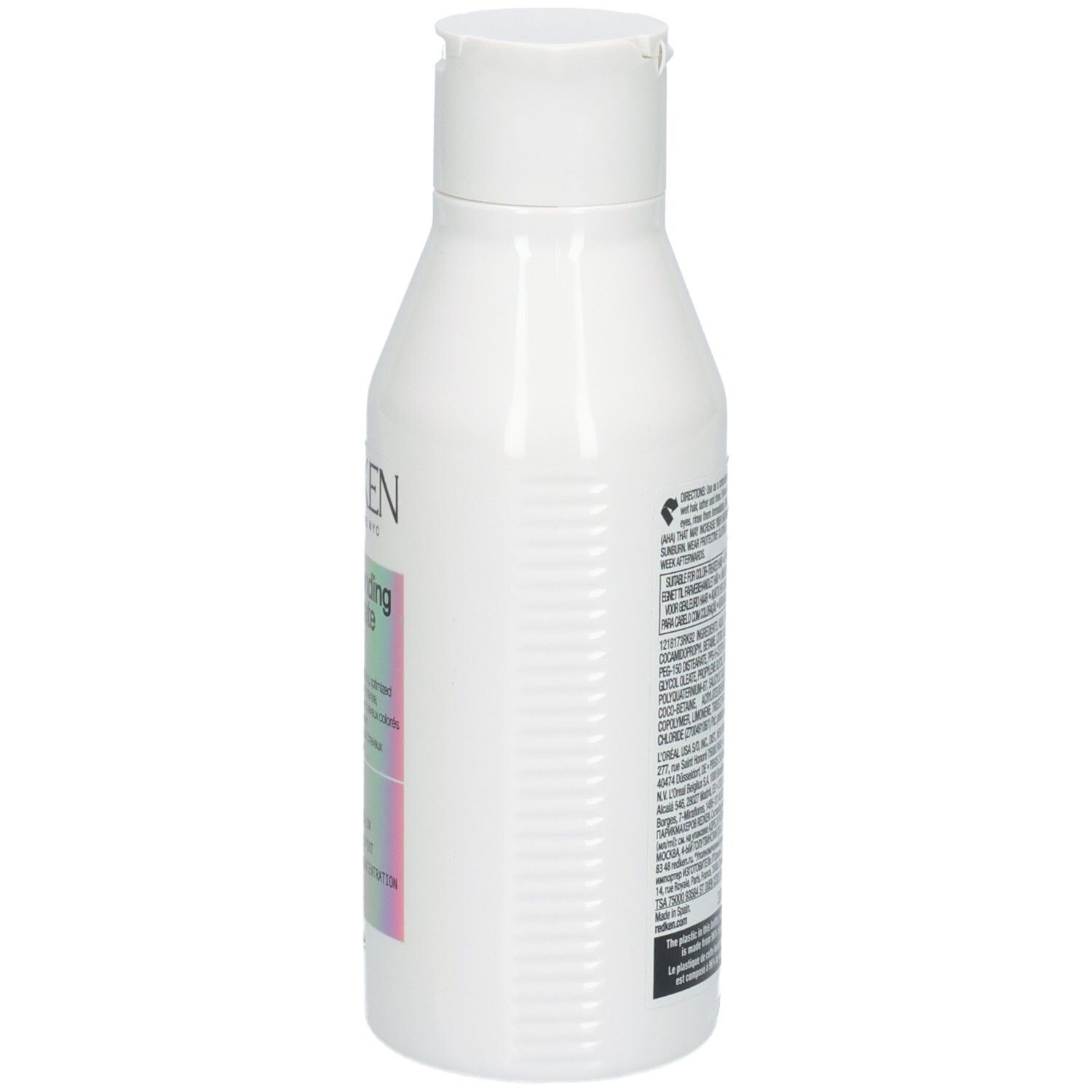 Weiße Shampoo-Flasche. Aufkleber mit Produktnamen und Inhaltsangaben. Marke: Redken. 300ml.