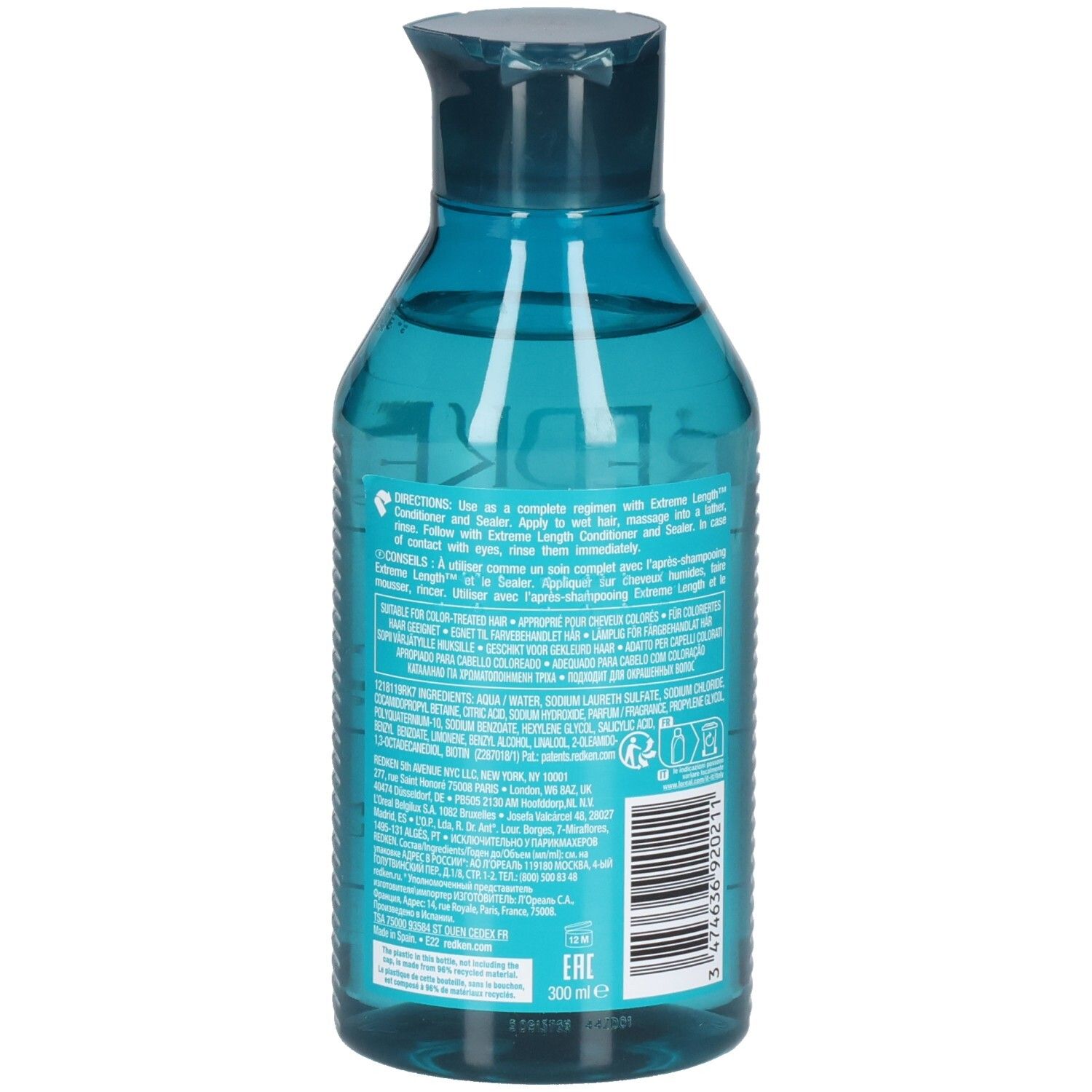 Rückseite einer blau-transparenten Shampoo-Flasche. Barcode und Text. Enthält Inhaltsstoffe und Anweisungen.