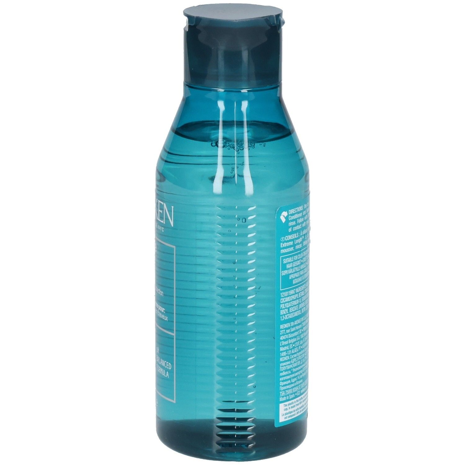 Rückseite einer blau-transparenten Shampoo-Flasche. Barcode und Text. Enthält Inhaltsstoffe und Anweisungen.