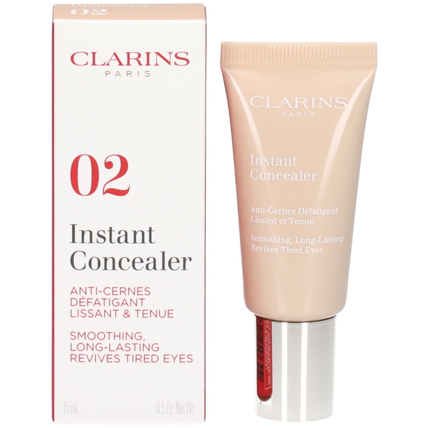 Clarins Instant Concealer, Nr. 02, und seine Verpackung. Der Concealer ist in einem hellbeigen Tubus, die Box ist rot und weiß.