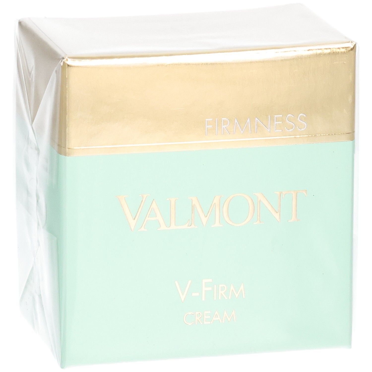 Valmont V-Firm Cream Verpackung mit goldener und mintgrüner Banderole. "FIRM NESS" und "VALMONT" sind auf der Vorderseite aufgedruckt.