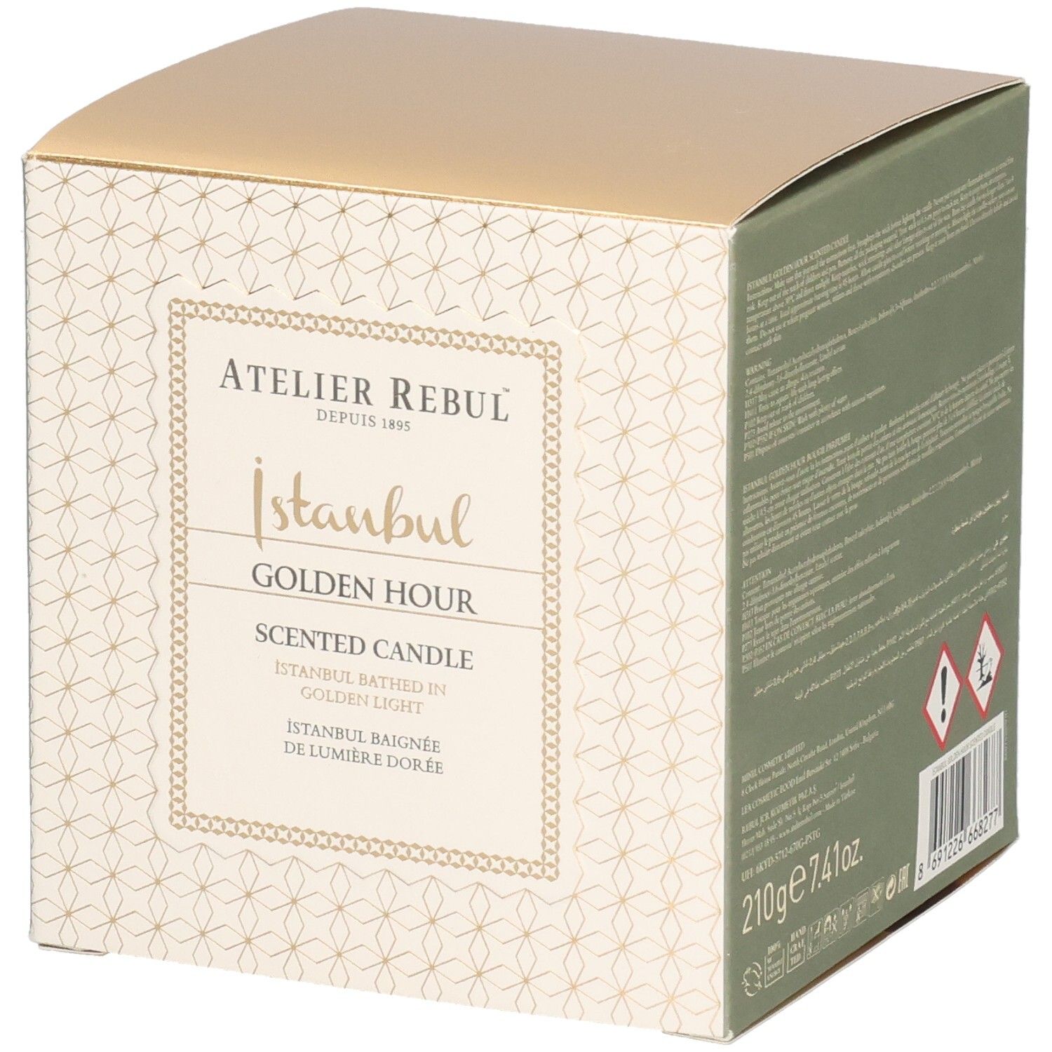 Quadratische Verpackung. Aufschrift: Atelier Rebul, Istanbul Golden Hour Scented Candle. Goldfarbener Deckel, cremefarbene Seiten mit Muster.