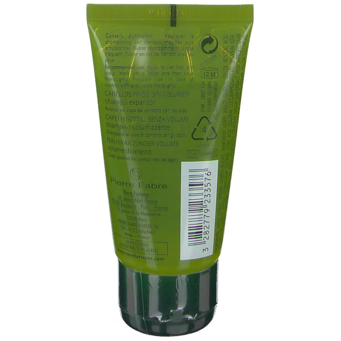 Rückseite der grünen Tube. Text in mehreren Sprachen. Schwarzer Verschluss. Herstellerinformationen.