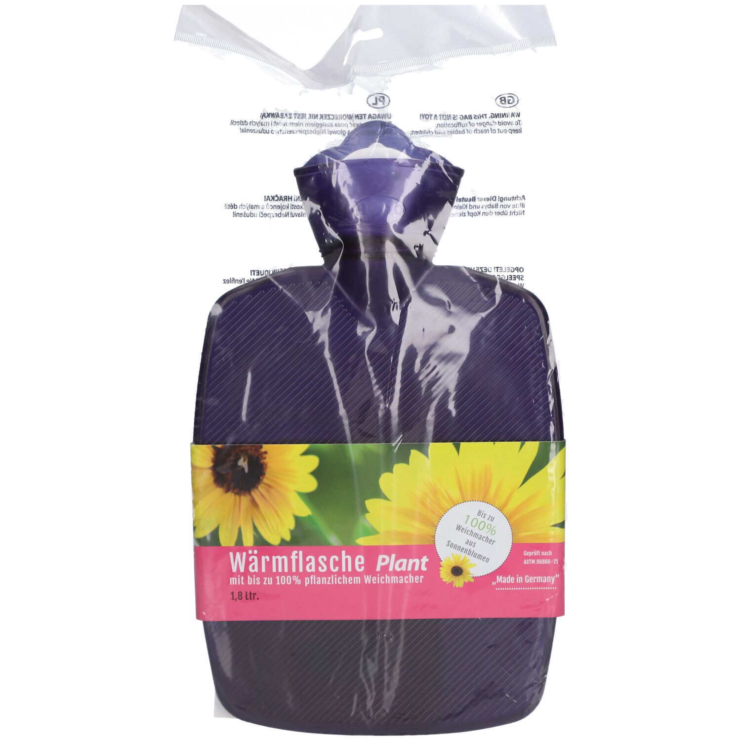 Wärmflasche in Verpackung. Violett, mit Sonnenblumenmotiv. 1,8 Liter. Aufschrift: Wärmflasche Plant, 100% Weichmacher.