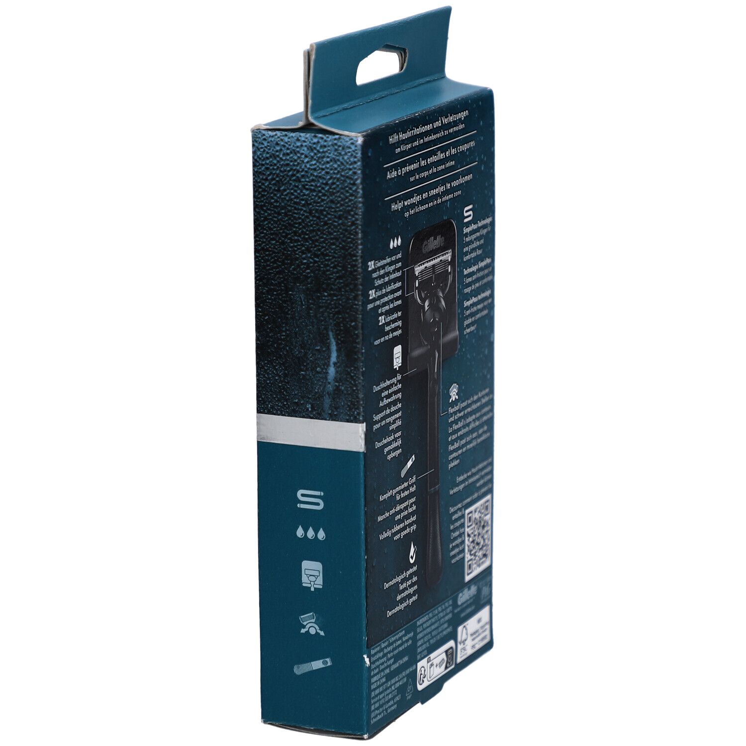 Seitenansicht der Verpackung. Text: Gillette. Enthält Rasierer für Körper & Intimbereich. Mit QR-Code.