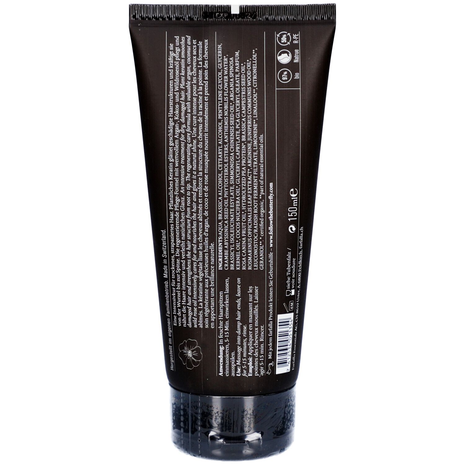 Rückseite der Haarmaske-Tube. Text: Inhaltsstoffe, Anwendungshinweise, Herstellerinformationen. Schwarze Tube mit Klappverschluss.