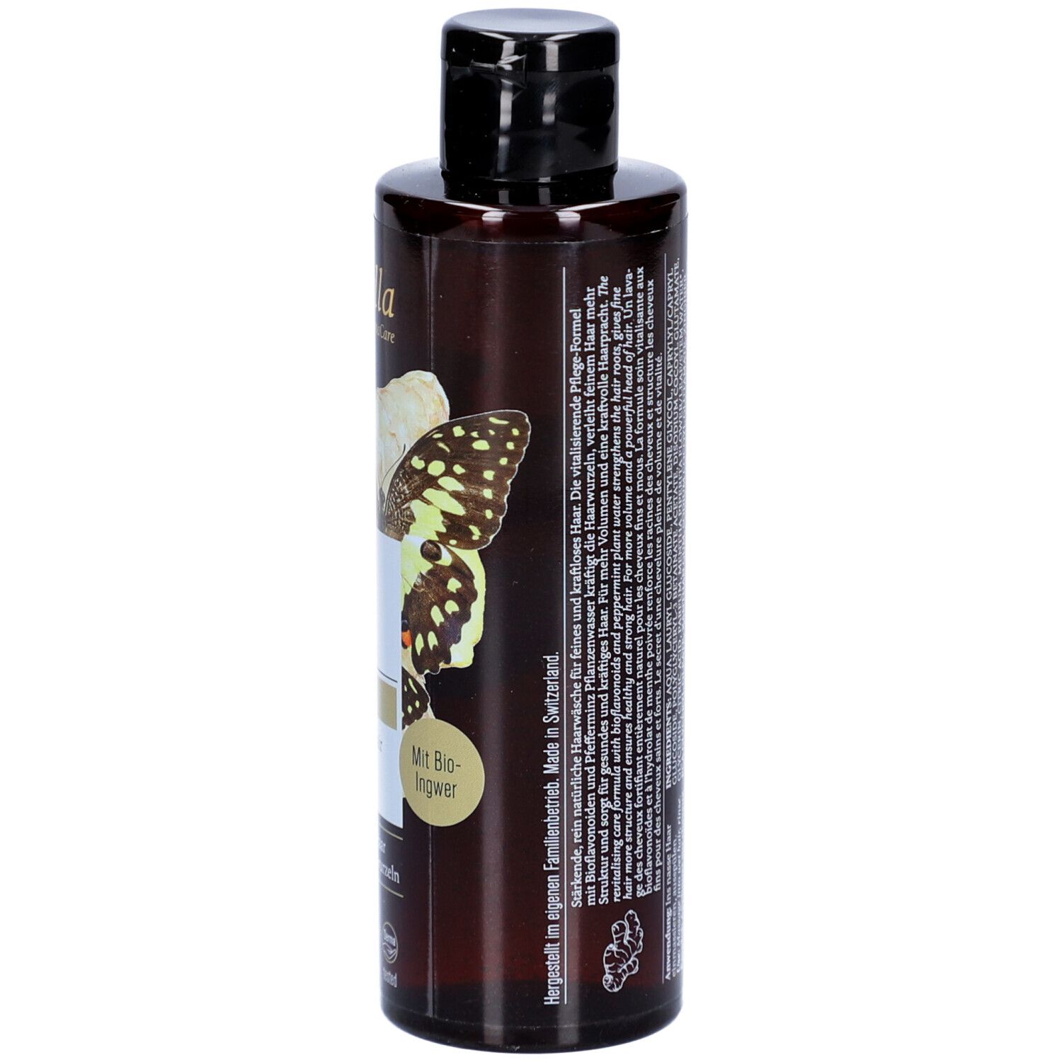 Rückseite einer braunen Shampoo-Flasche mit schwarzem Deckel. Text: Herstellerinformationen, Inhaltsstoffe, Logos.