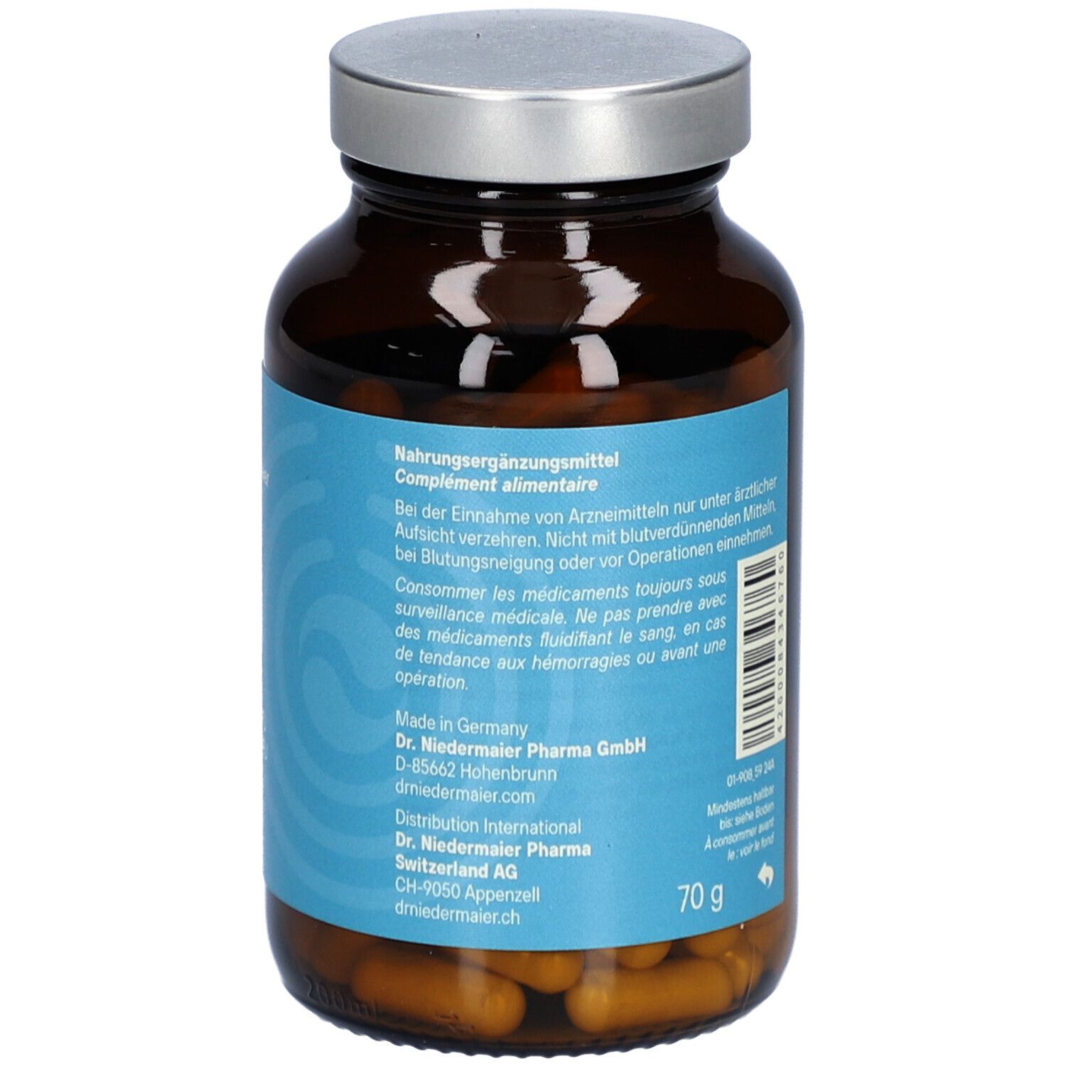 Braune Glasflasche mit silbernem Deckel. Etikett mit Produktinformationen und Herstelleradresse. 70g Inhalt.