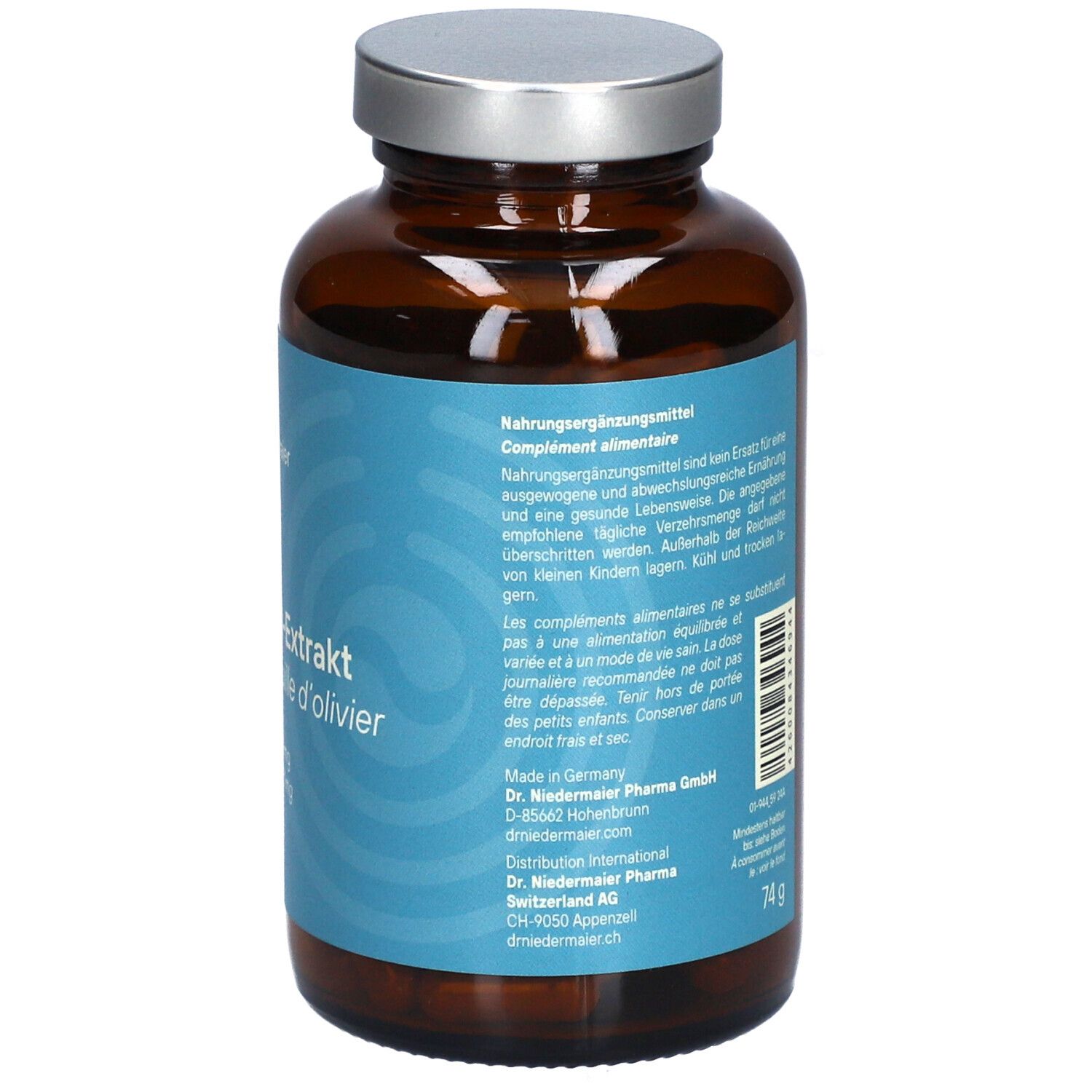 Braune Glasflasche mit silbernem Deckel. Rückseite mit Produktinformationen, Herstelleradresse und Gewicht.