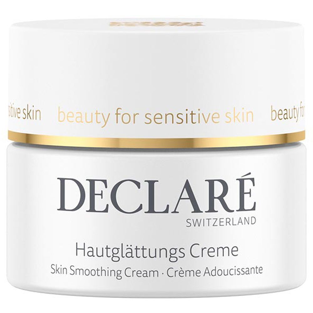 Weißes Creme-Tiegel mit goldfarbenem Rand. Aufschrift: DECLARÉ, Hautglättungs Creme. Text: Skin Smoothing Cream, Crème Adoucissante.