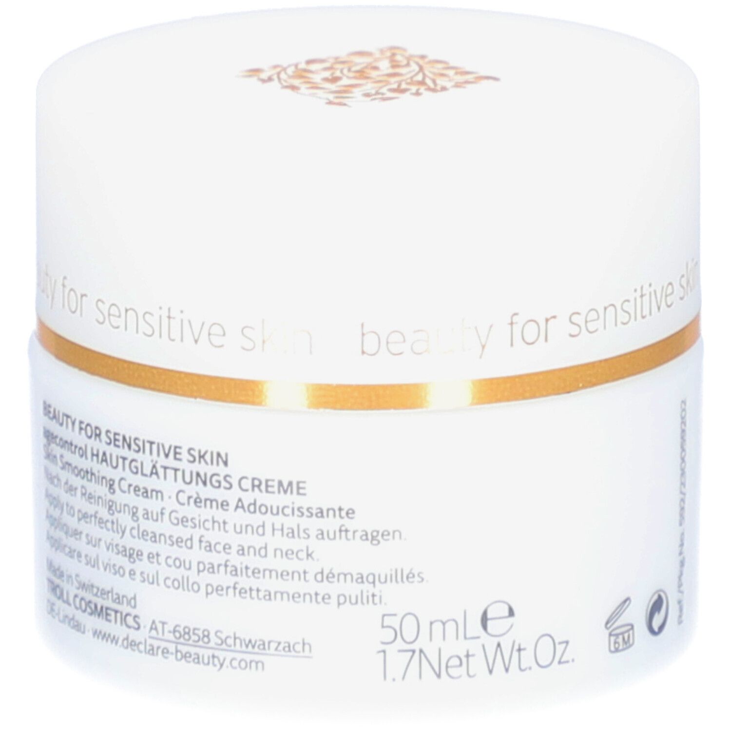 Weißer Creme-Tiegel mit goldfarbenem Rand. Aufschrift: DECLARÉ, Hautglättungs Creme. Text: Skin Smoothing Cream, Crème Adoucissante.