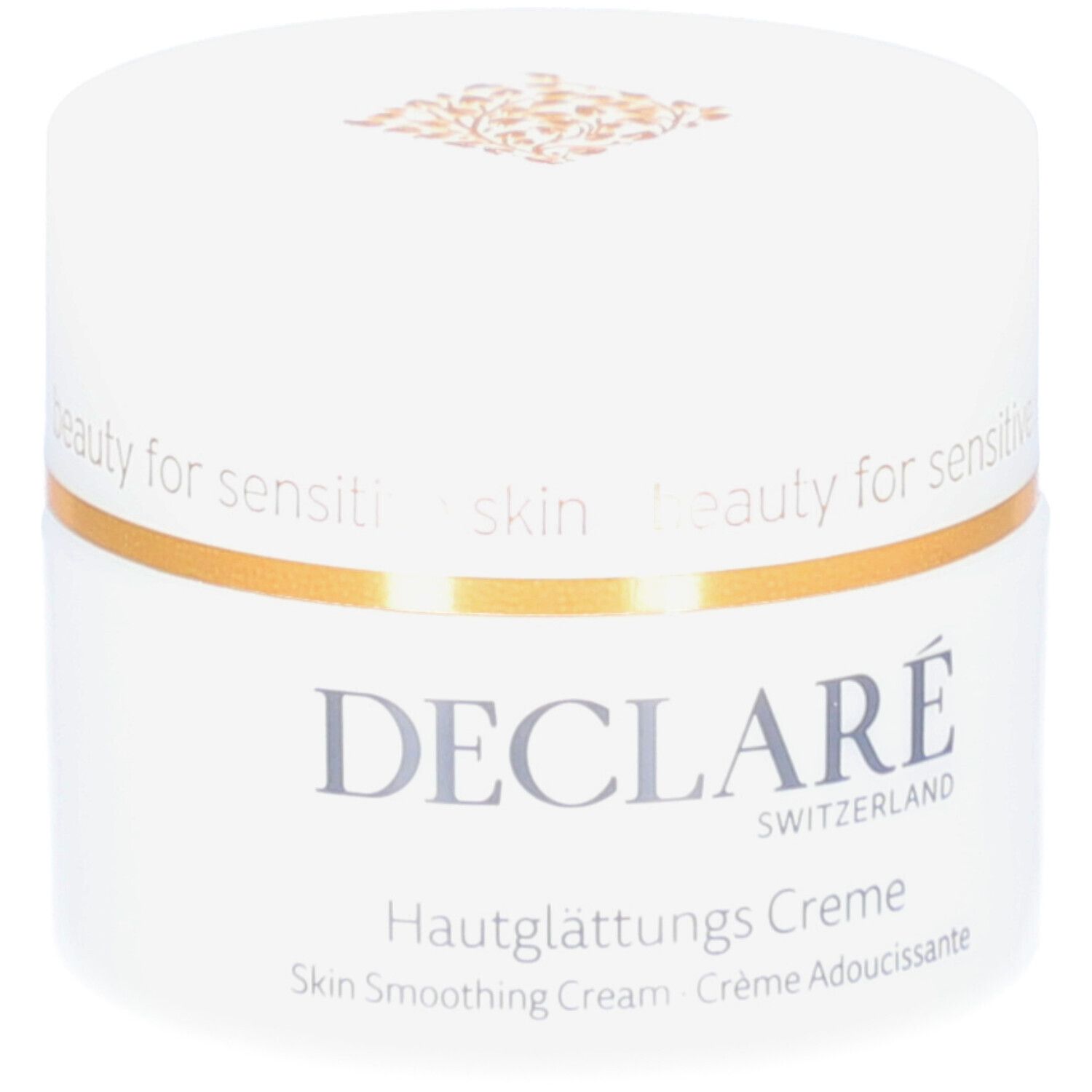 Weißer Creme-Tiegel mit goldfarbenem Rand. Aufschrift: DECLARÉ, Hautglättungs Creme. Text: Skin Smoothing Cream, Crème Adoucissante.