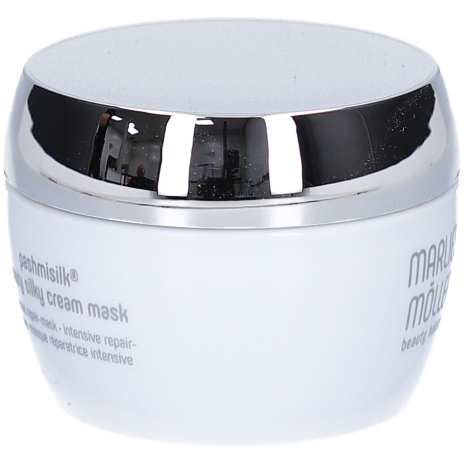 Weiße Dose mit silbernem Deckel. Aufschrift: Marlies Möller, pashmisilk luxury silky cream mask. Mehrsprachige Texte.