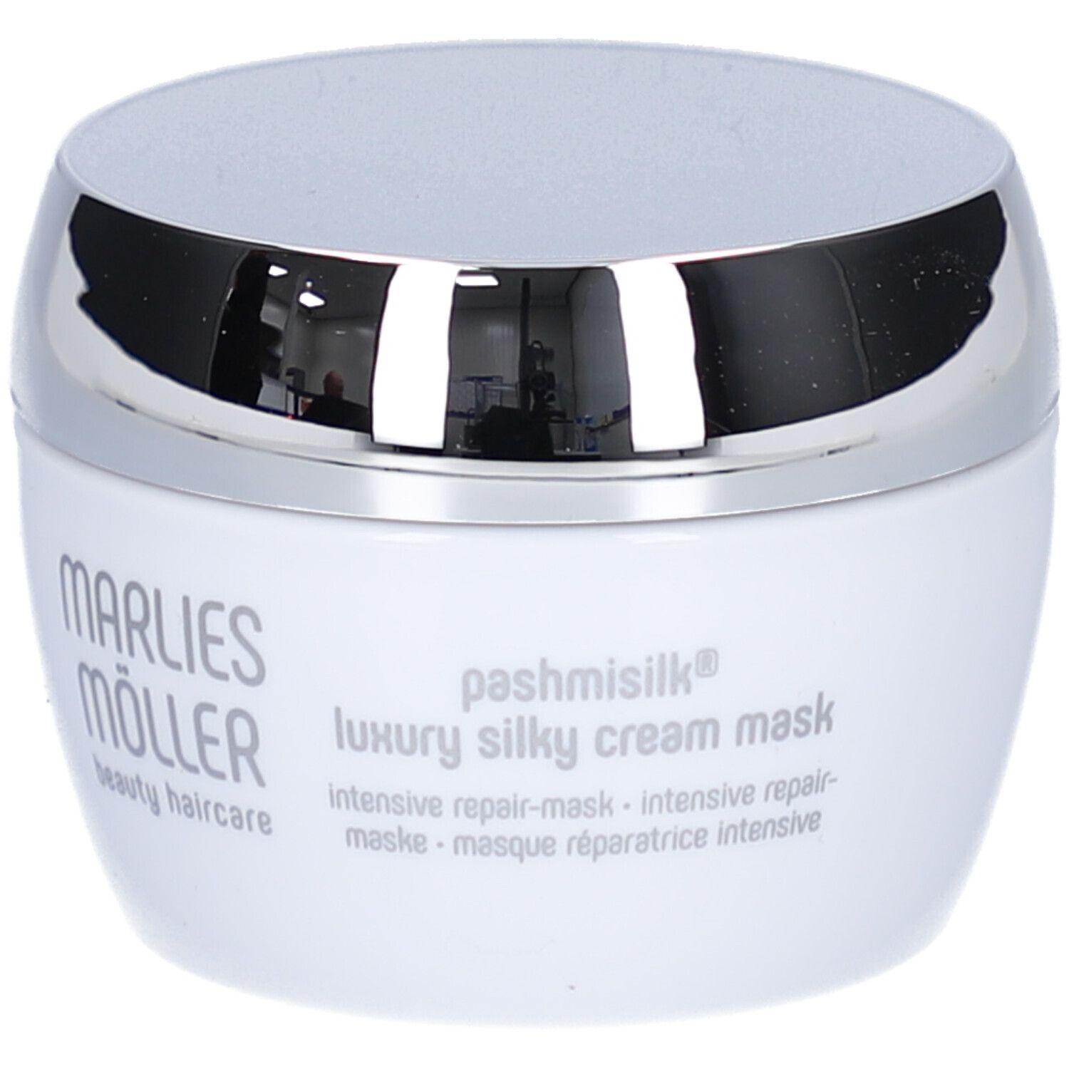 Weiße Dose mit silbernem Deckel. Aufschrift: Marlies Möller, pashmisilk luxury silky cream mask. Mehrsprachige Texte.