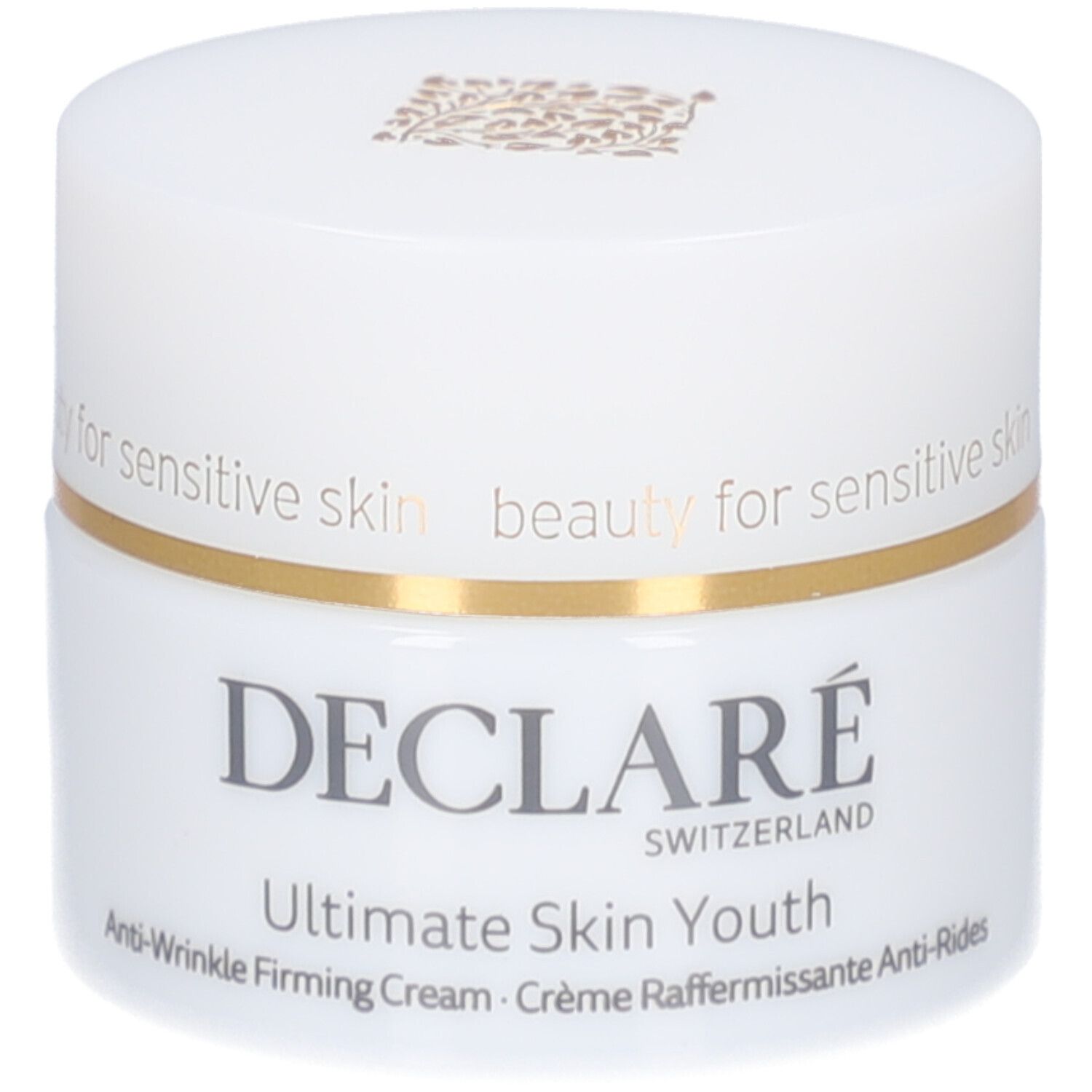 Weißer Tiegel mit Deckel. Goldfarbener Ring. Aufschrift: DECLARE, Ultimate Skin Youth Anti-Wrinkle Firming Cream.