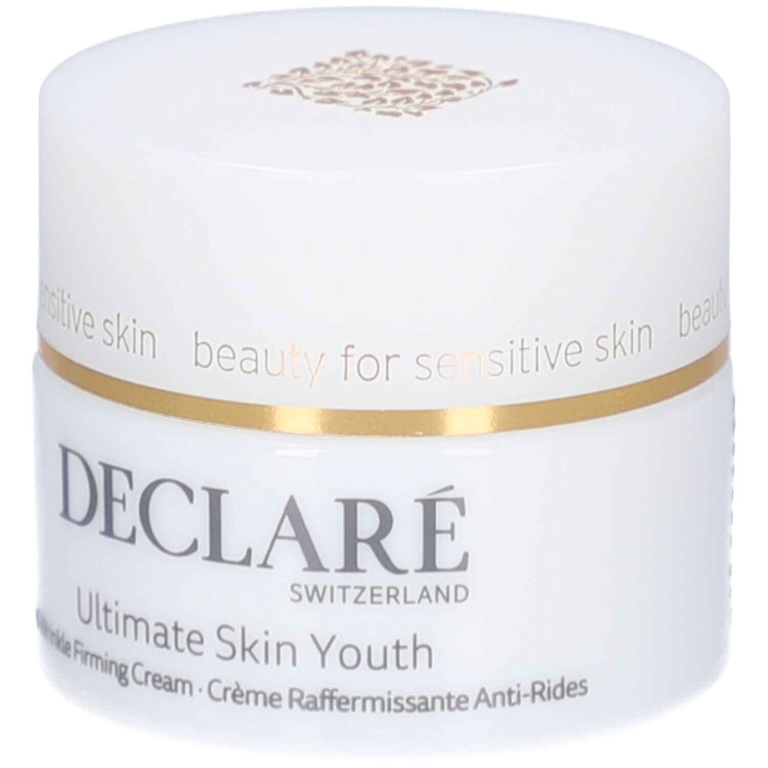 Weißer Tiegel mit Deckel. Goldfarbener Ring. Aufschrift: DECLARE, Ultimate Skin Youth Anti-Wrinkle Firming Cream.