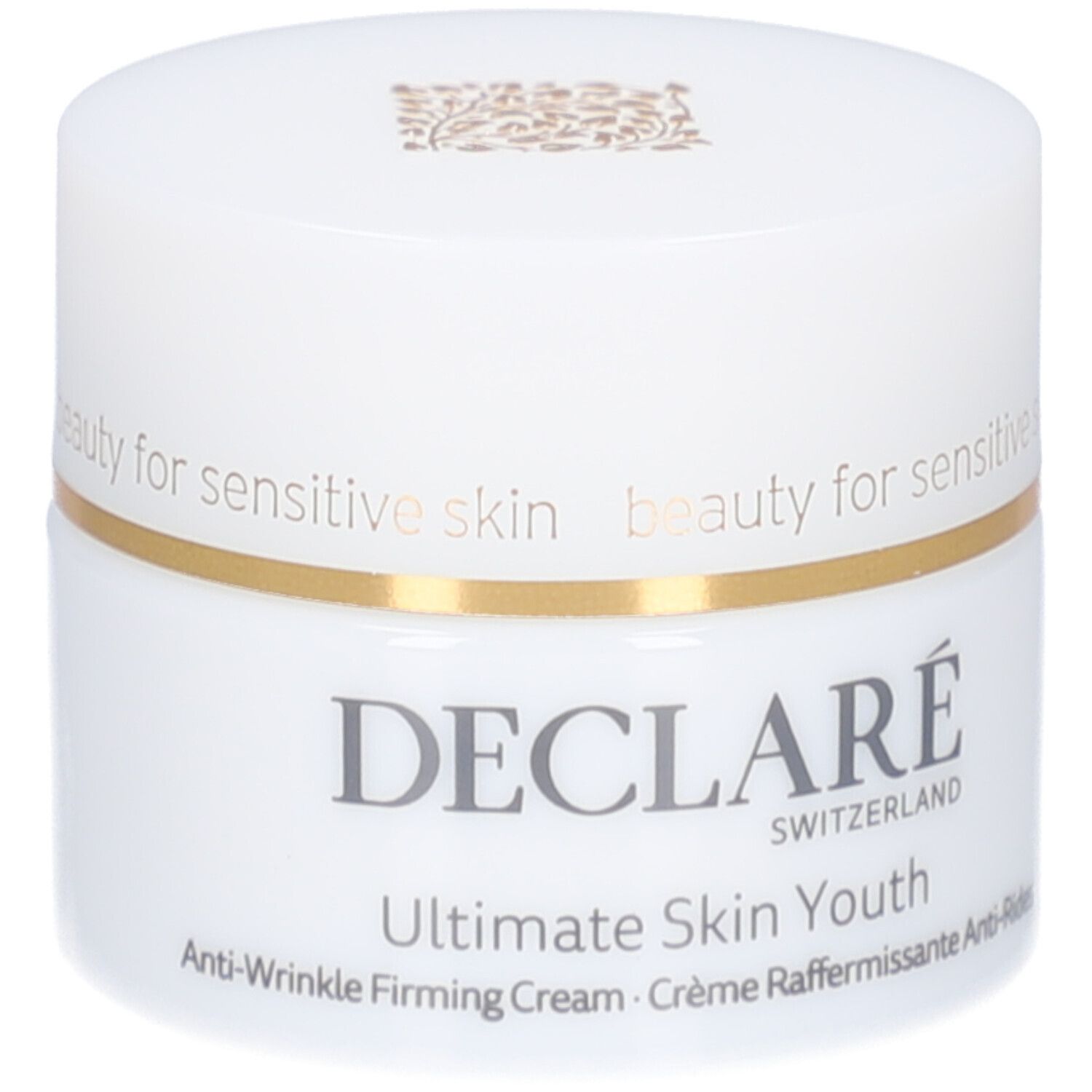 Weißer Tiegel mit Deckel. Goldfarbener Ring. Aufschrift: DECLARE, Ultimate Skin Youth Anti-Wrinkle Firming Cream.